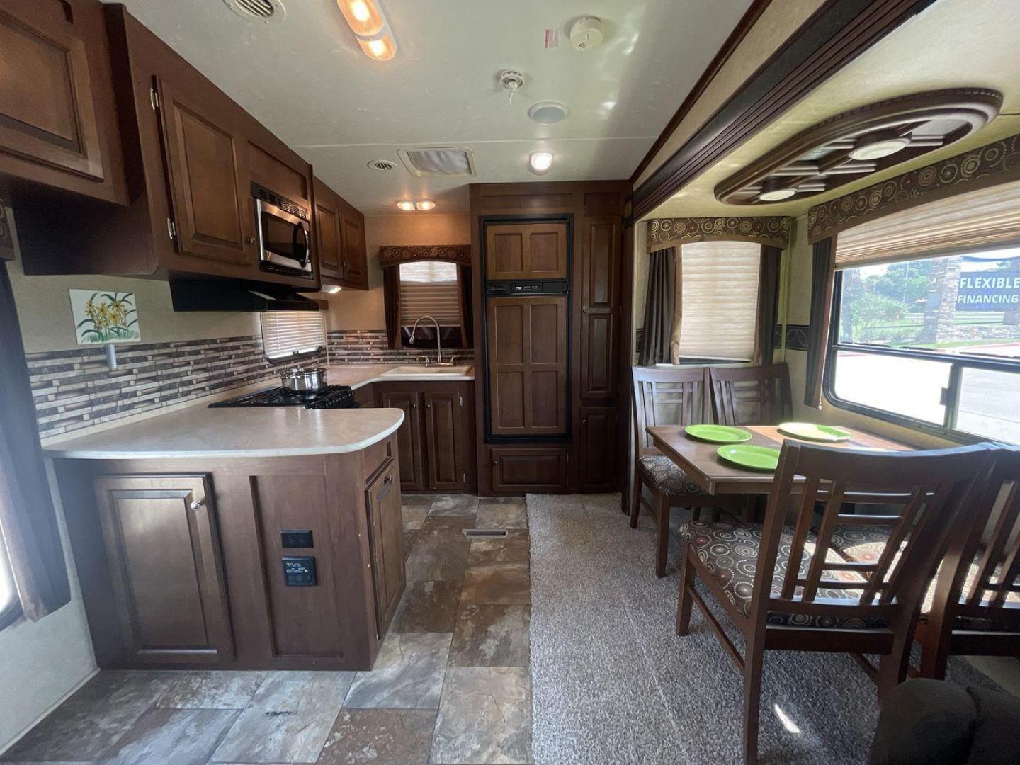 2014 WHITE JAYCO EAGLE 285RKDS (1UJCJ0BP7E2) , located at 4319 N Main St, Cleburne, TX, 76033, (817) 678-5133, 32.385960, -97.391212 - This 2014 Jayco Eagle Fifth Wheel measures just over 32 feet tall and 8 feet wide with a dry weight of 8,390 lbs. It has a GVWR of 10,500 lbs and a hitch weight of 1,725 lbs. This unit also comes with standard automatic heating and automatic cooling rated at 13,500 BTUs. The exterior of this model i - Photo#13