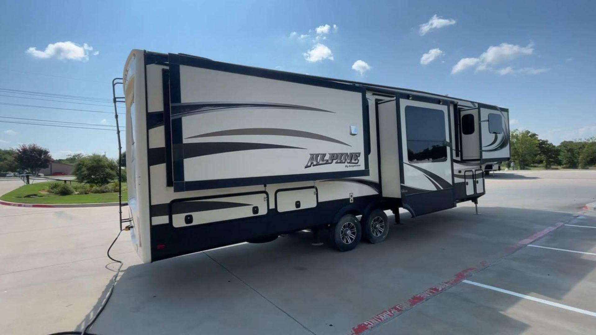 2014 GRAY KEYSTONE ALPINE 3620FL (4YDF36222EE) , Length: 39.08 ft. | Dry Weight: 12,370 lbs. | Gross Weight: 15,500 lbs. | Slides: 6 transmission, located at 4319 N Main St, Cleburne, TX, 76033, (817) 678-5133, 32.385960, -97.391212 - Experience the 2014 Alpine 3620FL fifth wheel, the pinnacle of comfort and elegance. This RV, painstakingly designed and built by Alpine, provides the best possible fifth wheel travel experience for individuals who want nothing less. The dimensions of this unit are 39.08 ft in length, 8 ft in width, - Photo#1