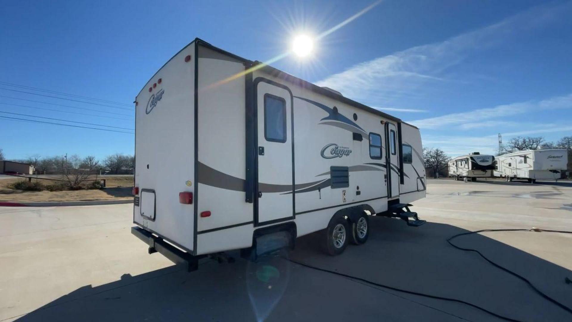 2014 WHITE KEYSTONE COUGAR MDL 260RB (4YDT26027EV) , Length: 29.67 ft. | Dry Weight: 5,065 lbs. | Slides: 1 transmission, located at 4319 N Main St, Cleburne, TX, 76033, (817) 678-5133, 32.385960, -97.391212 - The 2014 Keystone Cougar Model 260RB travel trailer offers the ideal fusion of elegance and utility. With its roomy and welcoming interior, this well-designed RV is a great option for both long trips and weekend excursions. This travel trailer has a length of 29.8 ft and weighs 5,065 lbs. It is s - Photo#1