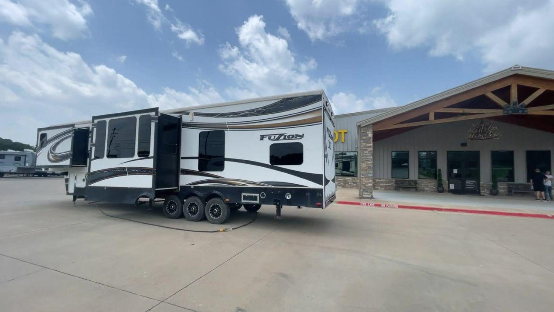 2014 WHITE KEYSTONE FUZION M-399 (4YDF39939EF) , Length: 41 ft. | Dry Weight: 14,100 lbs. | Gross Weight: 18,000 lbs. | Slides: 3 transmission, located at 4319 N Main St, Cleburne, TX, 76033, (817) 678-5133, 32.385960, -97.391212 - The 2014 Keystone Fuzion M-399 offers exceptional value for its price. With its white exterior color, this RV stands out on the road and is sure to turn heads wherever you go. Measuring 41 ft. in length, this toy hauler provides ample space for you and your loved ones to relax and enjoy your travels - Photo#7