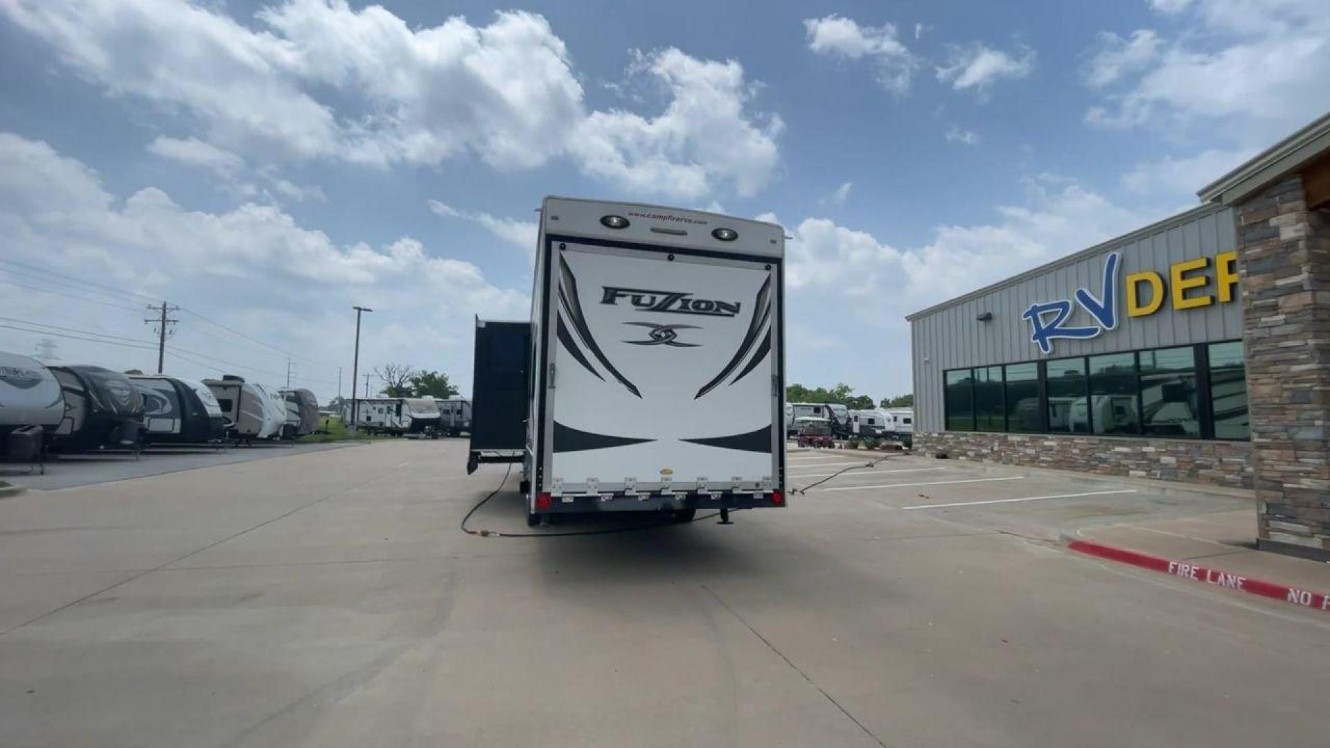 2014 WHITE KEYSTONE FUZION M-399 (4YDF39939EF) , Length: 41 ft. | Dry Weight: 14,100 lbs. | Gross Weight: 18,000 lbs. | Slides: 3 transmission, located at 4319 N Main St, Cleburne, TX, 76033, (817) 678-5133, 32.385960, -97.391212 - The 2014 Keystone Fuzion M-399 offers exceptional value for its price. With its white exterior color, this RV stands out on the road and is sure to turn heads wherever you go. Measuring 41 ft. in length, this toy hauler provides ample space for you and your loved ones to relax and enjoy your travels - Photo#8