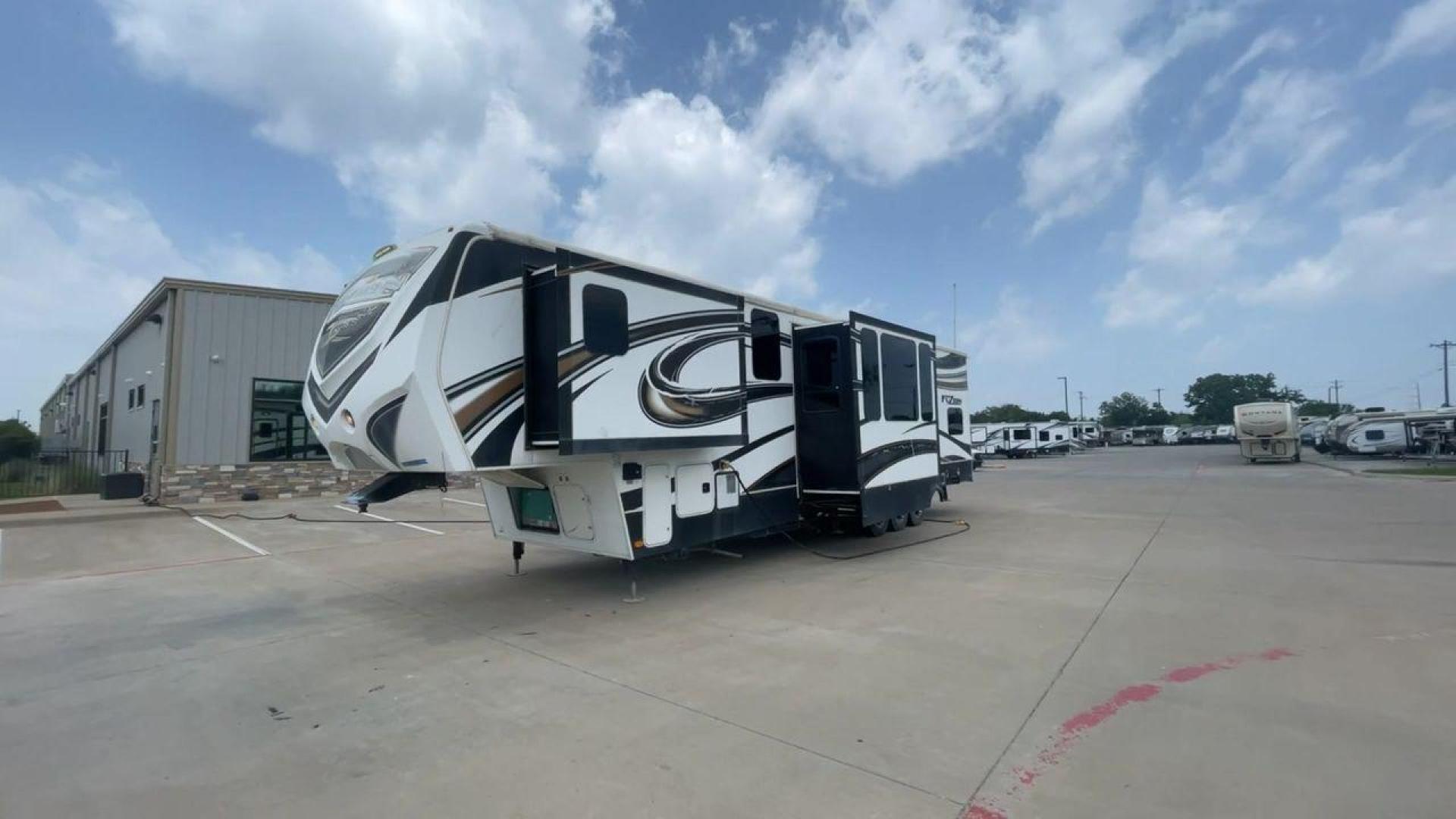 2014 WHITE KEYSTONE FUZION M-399 (4YDF39939EF) , Length: 41 ft. | Dry Weight: 14,100 lbs. | Gross Weight: 18,000 lbs. | Slides: 3 transmission, located at 4319 N Main St, Cleburne, TX, 76033, (817) 678-5133, 32.385960, -97.391212 - The 2014 Keystone Fuzion M-399 offers exceptional value for its price. With its white exterior color, this RV stands out on the road and is sure to turn heads wherever you go. Measuring 41 ft. in length, this toy hauler provides ample space for you and your loved ones to relax and enjoy your travels - Photo#5