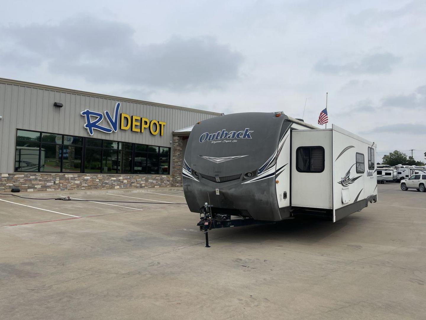 2014 WHITE KEYSTONE OUTBACK 300RB (4YDT30025EB) , Length: 33.67 ft | Dry Weight: 7,432 lbs | Gross Weight: 9,000 lbs | Slides: 1 transmission, located at 4319 N Main St, Cleburne, TX, 76033, (817) 678-5133, 32.385960, -97.391212 - The 2014 Keystone Outback 300RB is a flexible and roomy travel trailer made for families and people who love the outdoors. This trailer is 33.67 feet long and weighs 7,432 pounds dry. It has a lot of living room but is still light and easy to tow. Its body and sidewalls are made of aluminum, which m - Photo#0