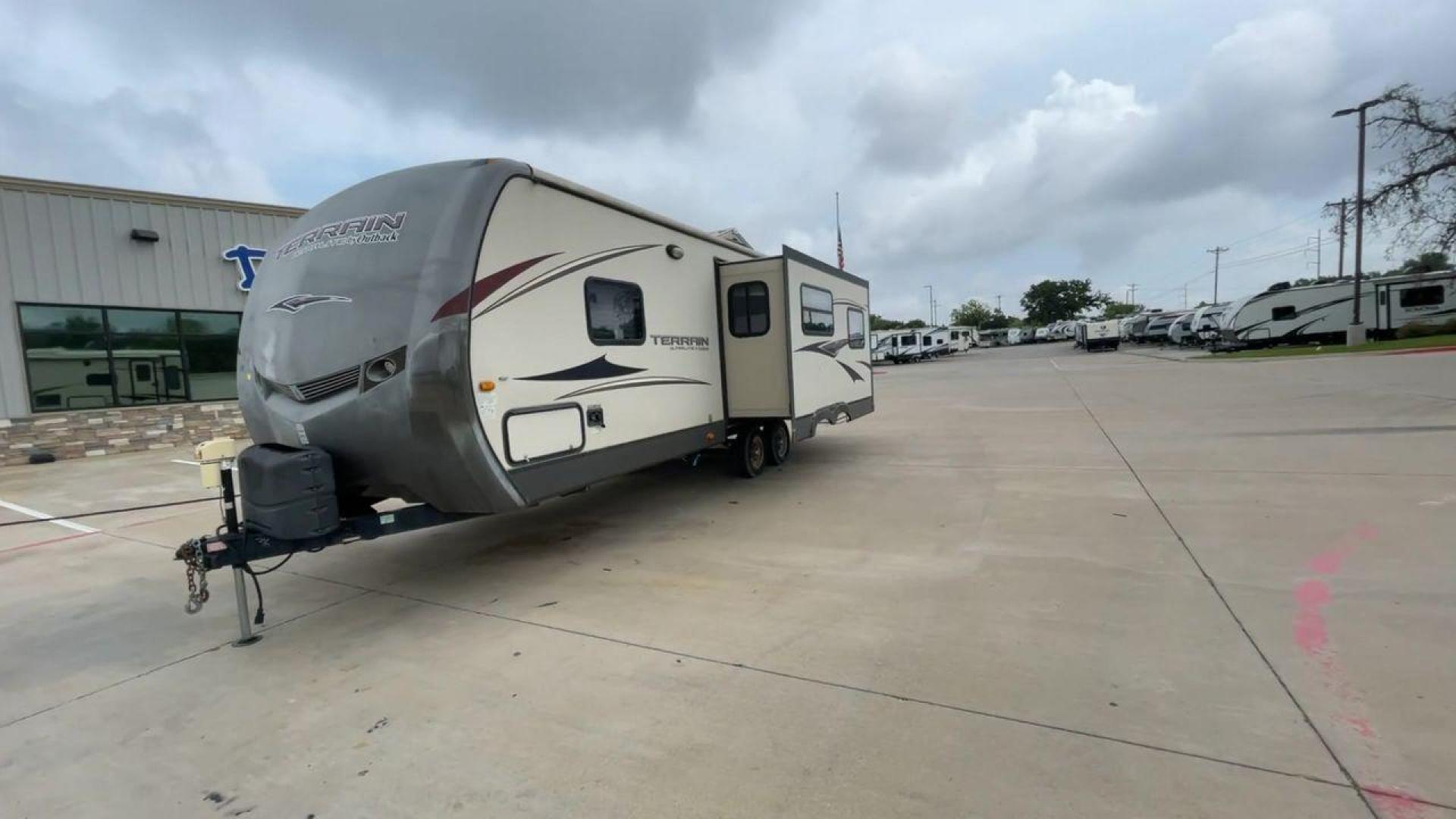 2014 TAN KEYSTONE OUTBACK TERRAIN 273T (4YDT27323EB) , Length: 30 ft. | Dry Weight: 5,758 lbs. | Gross Weight: 7,800 lbs. | Slides: 1 transmission, located at 4319 N Main St, Cleburne, TX, 76033, (817) 678-5133, 32.385960, -97.391212 - With the 2014 Keystone Outback Terrain 273TRL travel trailer, set out on your next adventure. This well-thought-out RV offers the ideal balance of flair and utility, making it a home away from home for your journeys. The dimensions of this unit are 30 ft in length, 8 ft in width, and 10.92 ft in - Photo#5