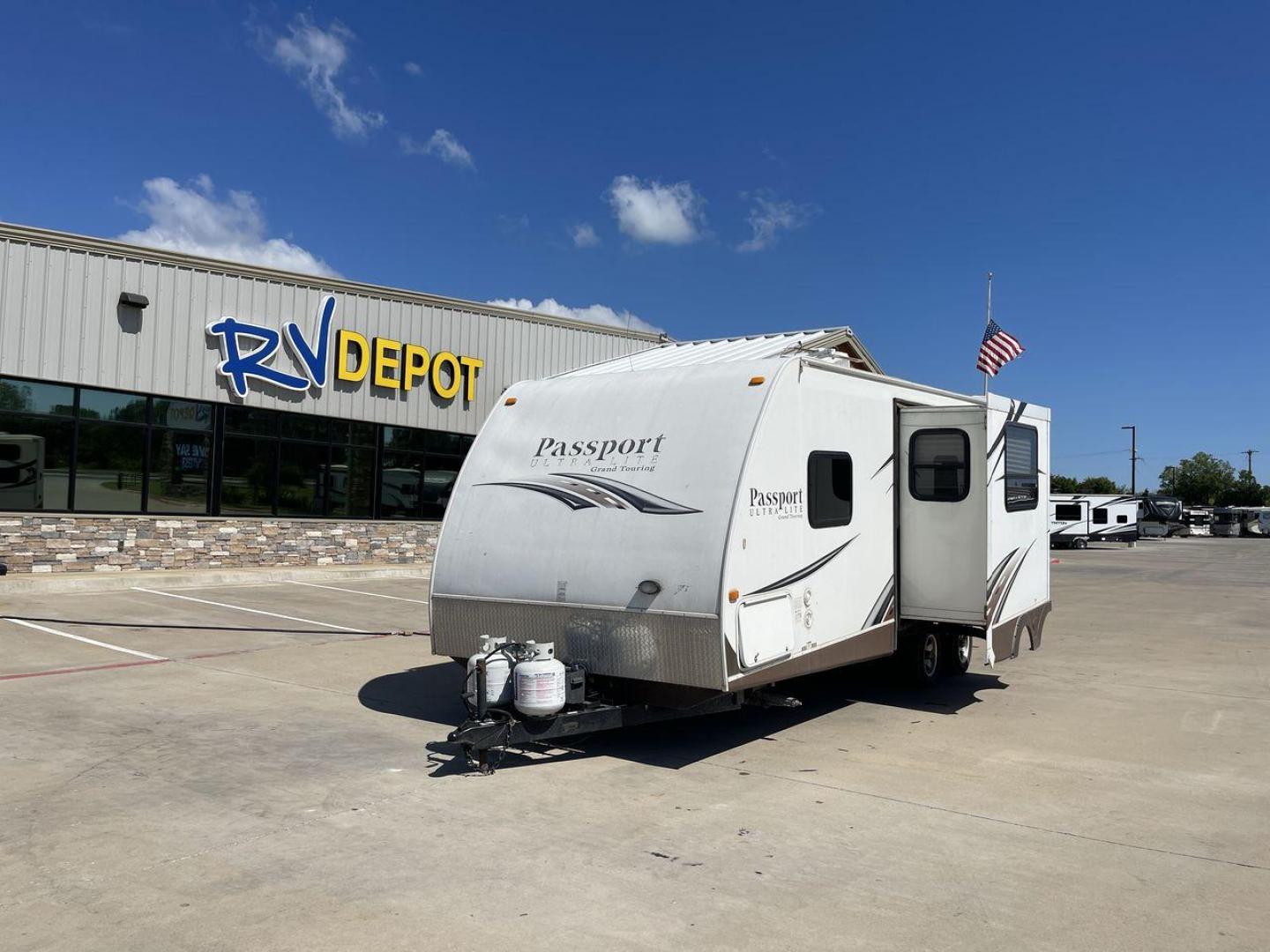 2014 WHITE KEYSTONE PASSPORT 2400BH (4YDT24029ET) , Length: 27.83 ft. | Dry Weight: 4,730 lbs. | Gross Weight: 6,800 lbs. | Slides: 1 transmission, located at 4319 N Main St, Cleburne, TX, 76033, (817) 678-5133, 32.385960, -97.391212 - The 2014 Keystone Passport 2400BH is a dual-axle steel wheel set-up that measures 27.83 ft. in length. It has a dry weight of 4,730 lbs. and a GVWR of 6,800 lbs. It also has a payload capacity of 2,070 lbs. and a hitch weight of 515 lbs. Its exterior is a base color of white with black and brown acc - Photo#0