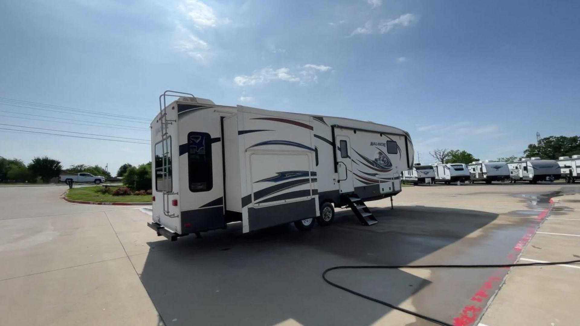 2014 KEYSTONE RV AVALANCHE 345TG (4YDF34521EE) , Length: 37.92 ft. | Dry Weight: 11,417 lbs. | Gross Weight: 14,140 lbs. | Slides: 3 transmission, located at 4319 N Main St, Cleburne, TX, 76033, (817) 678-5133, 32.385960, -97.391212 - Set out on an adventure filled with luxury and comfort in the 2014 Keystone Avalanche 345TG, a fifth wheel crafted to elevate your RV experience. With its 37.92-foot size, this model seamlessly blends sophisticated design with functional features, making it an ideal sanctuary for your travels. Built - Photo#1