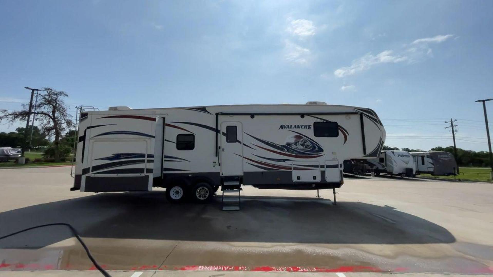 2014 KEYSTONE RV AVALANCHE 345TG (4YDF34521EE) , Length: 37.92 ft. | Dry Weight: 11,417 lbs. | Gross Weight: 14,140 lbs. | Slides: 3 transmission, located at 4319 N Main St, Cleburne, TX, 76033, (817) 678-5133, 32.385960, -97.391212 - Set out on an adventure filled with luxury and comfort in the 2014 Keystone Avalanche 345TG, a fifth wheel crafted to elevate your RV experience. With its 37.92-foot size, this model seamlessly blends sophisticated design with functional features, making it an ideal sanctuary for your travels. Built - Photo#2