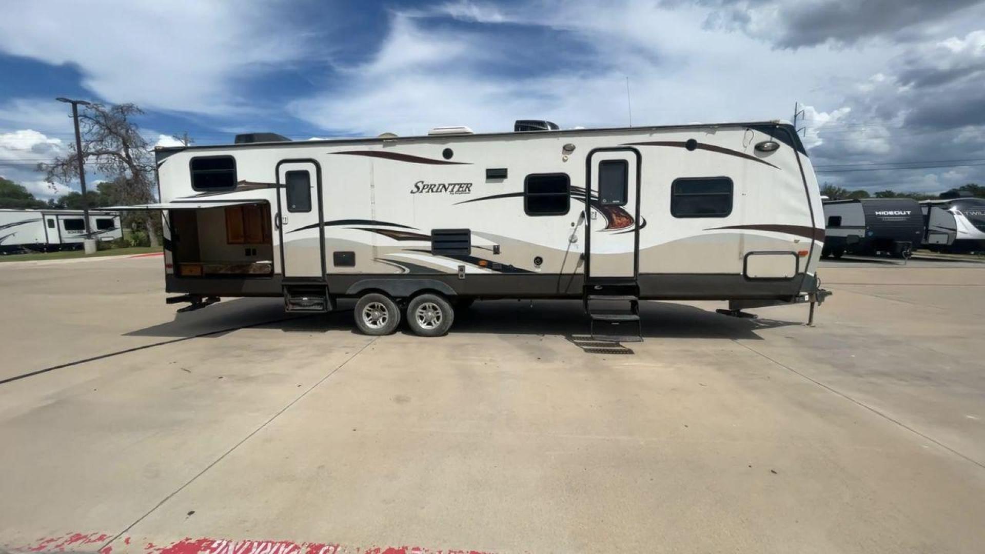 2014 WHITE KEYSTONE SPRINTER 311BHS - (4YDT31122E1) , Length: 35.33 ft. | Dry Weight: 8,260 lbs. | Gross Weight: 10,995 lbs. | Slides: 2 transmission, located at 4319 N Main St, Cleburne, TX, 76033, (817) 678-5133, 32.385960, -97.391212 - This 2014 Keystone Sprinter 311BHS is a dual-axle steel wheel setup that measures 35.33 ft. long. It has a dry weight of 8,260 lbs. and a GVWR of 10,995 lbs. It includes 2 power slides as well as 1 power awning. This travel trailer offers sleeping space for up to 10 people with its front queen bed - Photo#2