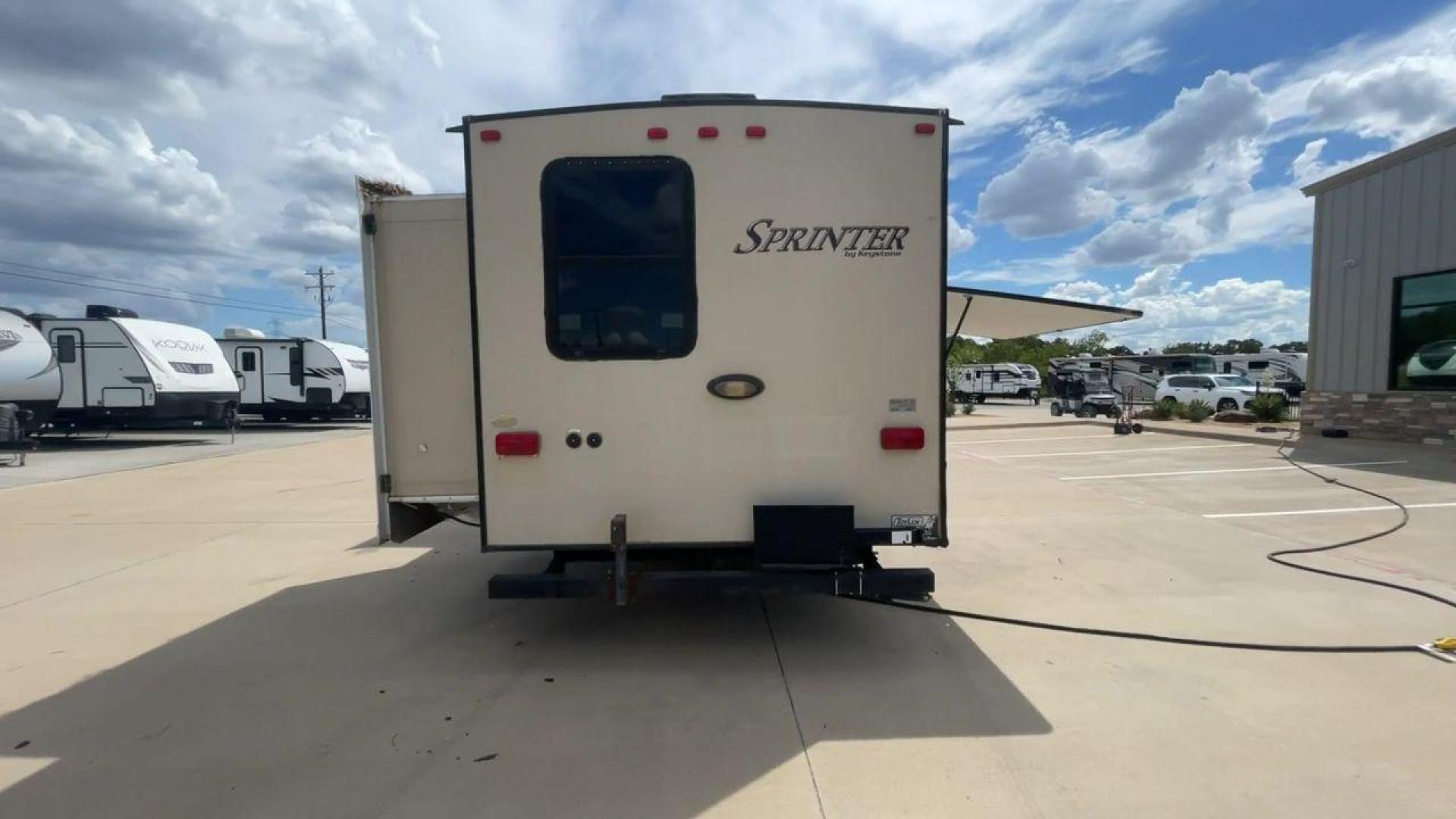 2014 WHITE KEYSTONE SPRINTER 311BHS - (4YDT31122E1) , Length: 35.33 ft. | Dry Weight: 8,260 lbs. | Gross Weight: 10,995 lbs. | Slides: 2 transmission, located at 4319 N Main St, Cleburne, TX, 76033, (817) 678-5133, 32.385960, -97.391212 - This 2014 Keystone Sprinter 311BHS is a dual-axle steel wheel setup that measures 35.33 ft. long. It has a dry weight of 8,260 lbs. and a GVWR of 10,995 lbs. It includes 2 power slides as well as 1 power awning. This travel trailer offers sleeping space for up to 10 people with its front queen bed - Photo#8