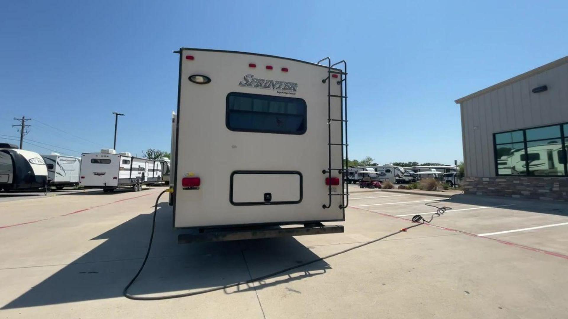 2014 WHITE KEYSTONE SPRINTER 333FWRLS - (4YDF33321E1) , Length: 37.33 ft. | Dry Weight: 9,598 lbs. | Gross Weight: 12,750 lbs. | Slides: 3 transmission, located at 4319 N Main St, Cleburne, TX, 76033, (817) 678-5133, 32.385960, -97.391212 - The 2014 Sprinter 333FWLS by Keystone luxury fifth wheel brings the spotlight to its elevated front living area floorplan with a rear private bedroom and a spacious center kitchen. It measures just 37.33 ft in length, 8 ft in width, and 12.5 ft in height. It has a base weight of 9,598 lbs with a pay - Photo#8