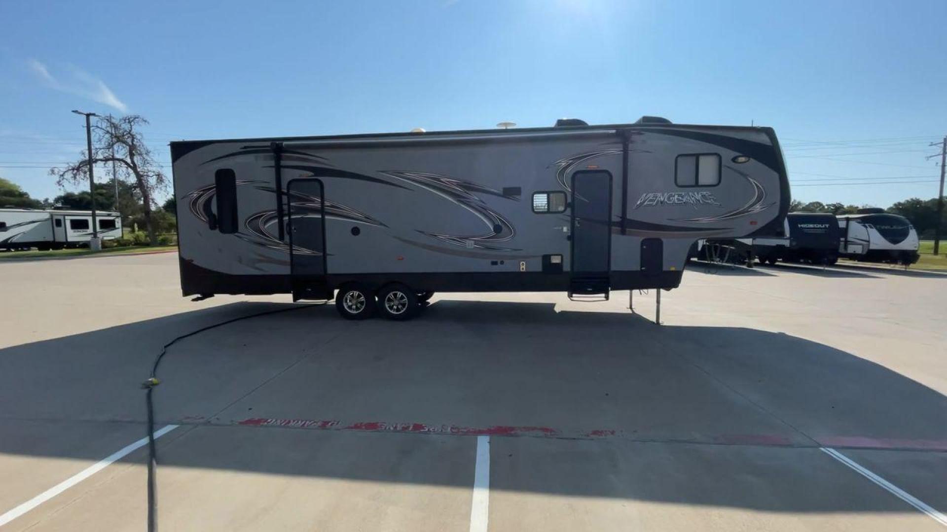 2014 KEYSTONE VENGEANCE 312A (4X4FVGG28EY) , Length: 37.92 ft. | Dry Weight: 10,068 lbs. | Gross Weight: 14,508 lbs. | Slides: 1 transmission, located at 4319 N Main St, Cleburne, TX, 76033, (817) 678-5133, 32.385960, -97.391212 - This 2014 Keystone Vengeance 312A measures 37.92 ft. in length and has a dry weight of 10,068 lbs. It also has a GVWR of 14,508 lbs. and a hitch weight of 2,508 lbs. This unit has automatic heating and cooling for optimal temperature control. It is made of aluminum and fiberglass. This model also co - Photo#2