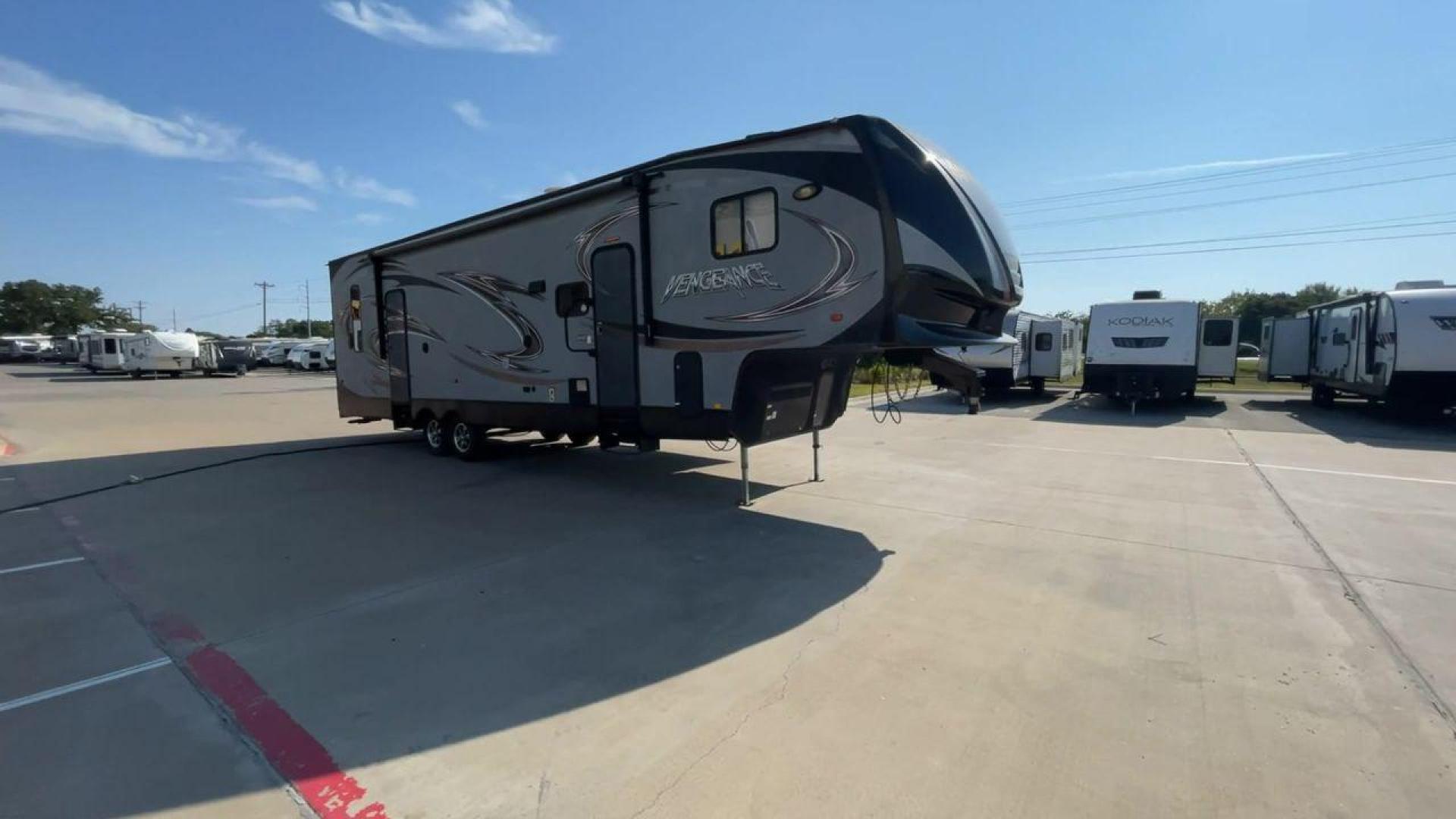 2014 KEYSTONE VENGEANCE 312A (4X4FVGG28EY) , Length: 37.92 ft. | Dry Weight: 10,068 lbs. | Gross Weight: 14,508 lbs. | Slides: 1 transmission, located at 4319 N Main St, Cleburne, TX, 76033, (817) 678-5133, 32.385960, -97.391212 - This 2014 Keystone Vengeance 312A measures 37.92 ft. in length and has a dry weight of 10,068 lbs. It also has a GVWR of 14,508 lbs. and a hitch weight of 2,508 lbs. This unit has automatic heating and cooling for optimal temperature control. It is made of aluminum and fiberglass. This model also co - Photo#3