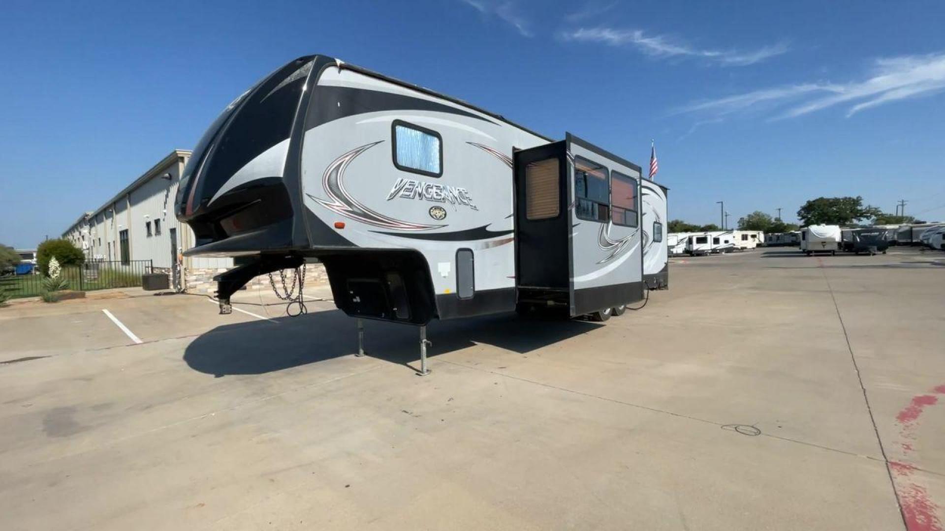 2014 KEYSTONE VENGEANCE 312A (4X4FVGG28EY) , Length: 37.92 ft. | Dry Weight: 10,068 lbs. | Gross Weight: 14,508 lbs. | Slides: 1 transmission, located at 4319 N Main St, Cleburne, TX, 76033, (817) 678-5133, 32.385960, -97.391212 - This 2014 Keystone Vengeance 312A measures 37.92 ft. in length and has a dry weight of 10,068 lbs. It also has a GVWR of 14,508 lbs. and a hitch weight of 2,508 lbs. This unit has automatic heating and cooling for optimal temperature control. It is made of aluminum and fiberglass. This model also co - Photo#5