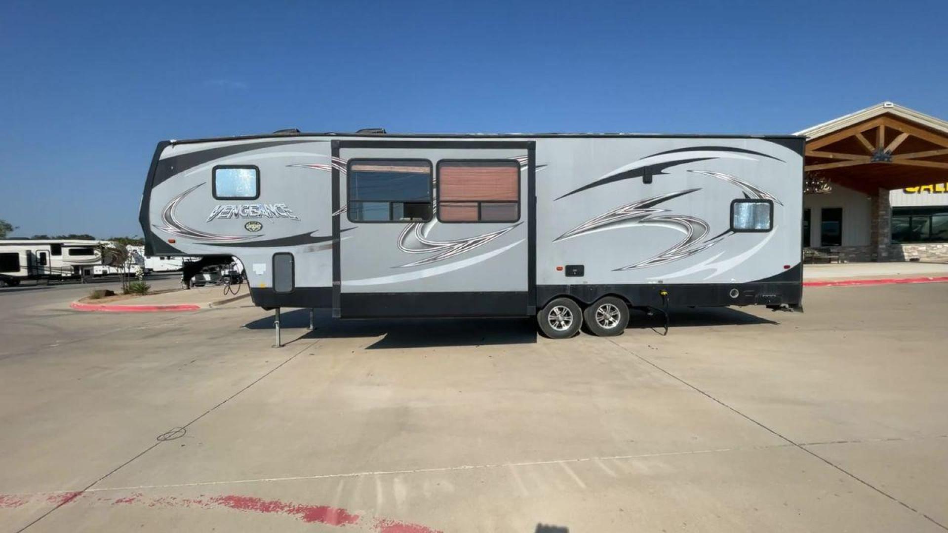 2014 KEYSTONE VENGEANCE 312A (4X4FVGG28EY) , Length: 37.92 ft. | Dry Weight: 10,068 lbs. | Gross Weight: 14,508 lbs. | Slides: 1 transmission, located at 4319 N Main St, Cleburne, TX, 76033, (817) 678-5133, 32.385960, -97.391212 - This 2014 Keystone Vengeance 312A measures 37.92 ft. in length and has a dry weight of 10,068 lbs. It also has a GVWR of 14,508 lbs. and a hitch weight of 2,508 lbs. This unit has automatic heating and cooling for optimal temperature control. It is made of aluminum and fiberglass. This model also co - Photo#6