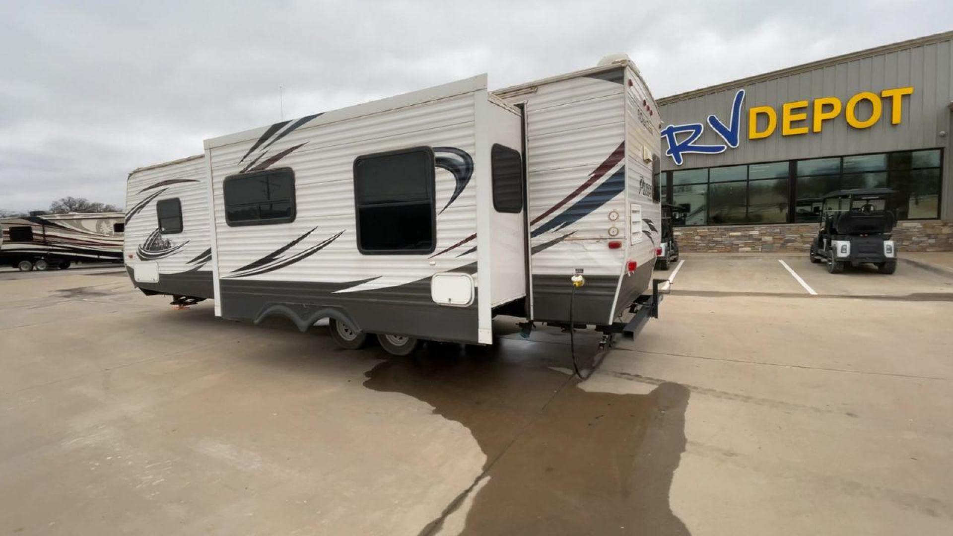 2014 WHITE PUMA 30RKSS (4X4TPUF23EP) , Length: 32.75 ft. | Dry Weight: 6,670 lbs. | Gross Weight: 9,827 lbs. | Slides: 1 transmission, located at 4319 N Main St, Cleburne, TX, 76033, (817) 678-5133, 32.385960, -97.391212 - Looking for a travel trailer that offers comfort, convenience, and style? Look no further than this 2014 PUMA 30RKSS available at RV Depot in Cleburne, TX. With its spacious interior, sleek white exterior, and rear living layout, this travel trailer is perfect for your next adventure. The PUMA 30RK - Photo#7