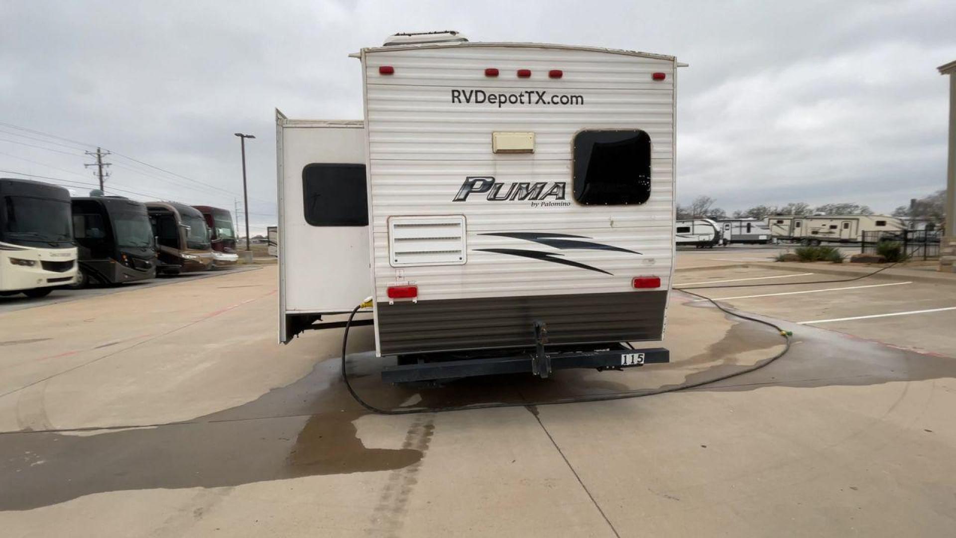 2014 WHITE PUMA 30RKSS (4X4TPUF23EP) , Length: 32.75 ft. | Dry Weight: 6,670 lbs. | Gross Weight: 9,827 lbs. | Slides: 1 transmission, located at 4319 N Main St, Cleburne, TX, 76033, (817) 678-5133, 32.385960, -97.391212 - Looking for a travel trailer that offers comfort, convenience, and style? Look no further than this 2014 PUMA 30RKSS available at RV Depot in Cleburne, TX. With its spacious interior, sleek white exterior, and rear living layout, this travel trailer is perfect for your next adventure. The PUMA 30RK - Photo#8