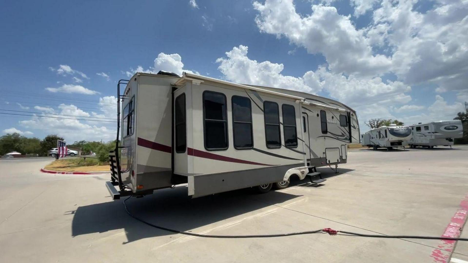 2014 TAN SABRE 34REQS-6 (4X4FSRK2XE3) , Length: 36 ft. | Dry Weight: 10,854 lbs. | Gross Weight: 13,704 lbs. | Slides: 4 transmission, located at 4319 N Main St, Cleburne, TX, 76033, (817) 678-5133, 32.385960, -97.391212 - This RV, which measures 36 feet in length and weighs 10,854 pounds dry, is designed to provide a luxurious and sumptuous living experience when traveling. With a gross weight of 13,704 pounds and four slides, including one in the bedroom, the 2014 Sabre 3REQS-6 Fifth Wheel will allow you plenty of s - Photo#1