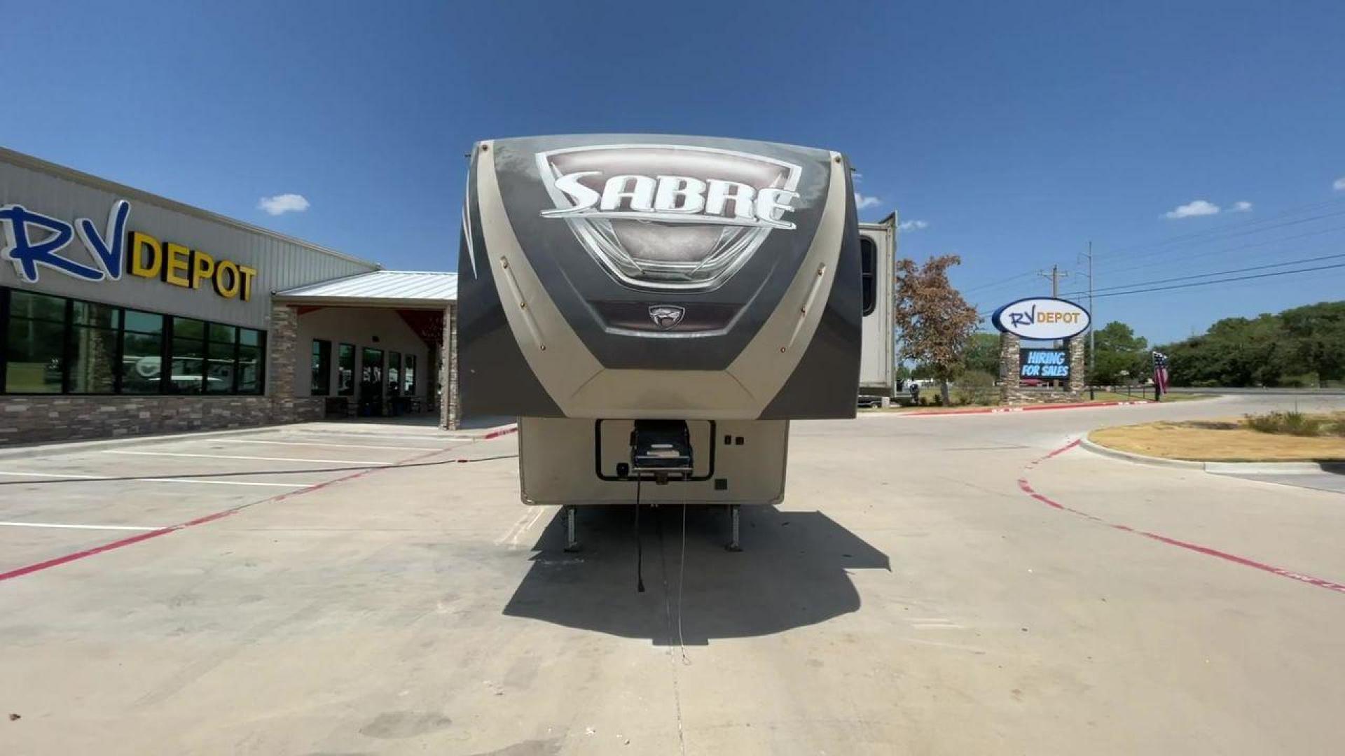 2014 TAN SABRE 34REQS-6 (4X4FSRK2XE3) , Length: 36 ft. | Dry Weight: 10,854 lbs. | Gross Weight: 13,704 lbs. | Slides: 4 transmission, located at 4319 N Main St, Cleburne, TX, 76033, (817) 678-5133, 32.385960, -97.391212 - This RV, which measures 36 feet in length and weighs 10,854 pounds dry, is designed to provide a luxurious and sumptuous living experience when traveling. With a gross weight of 13,704 pounds and four slides, including one in the bedroom, the 2014 Sabre 3REQS-6 Fifth Wheel will allow you plenty of s - Photo#4