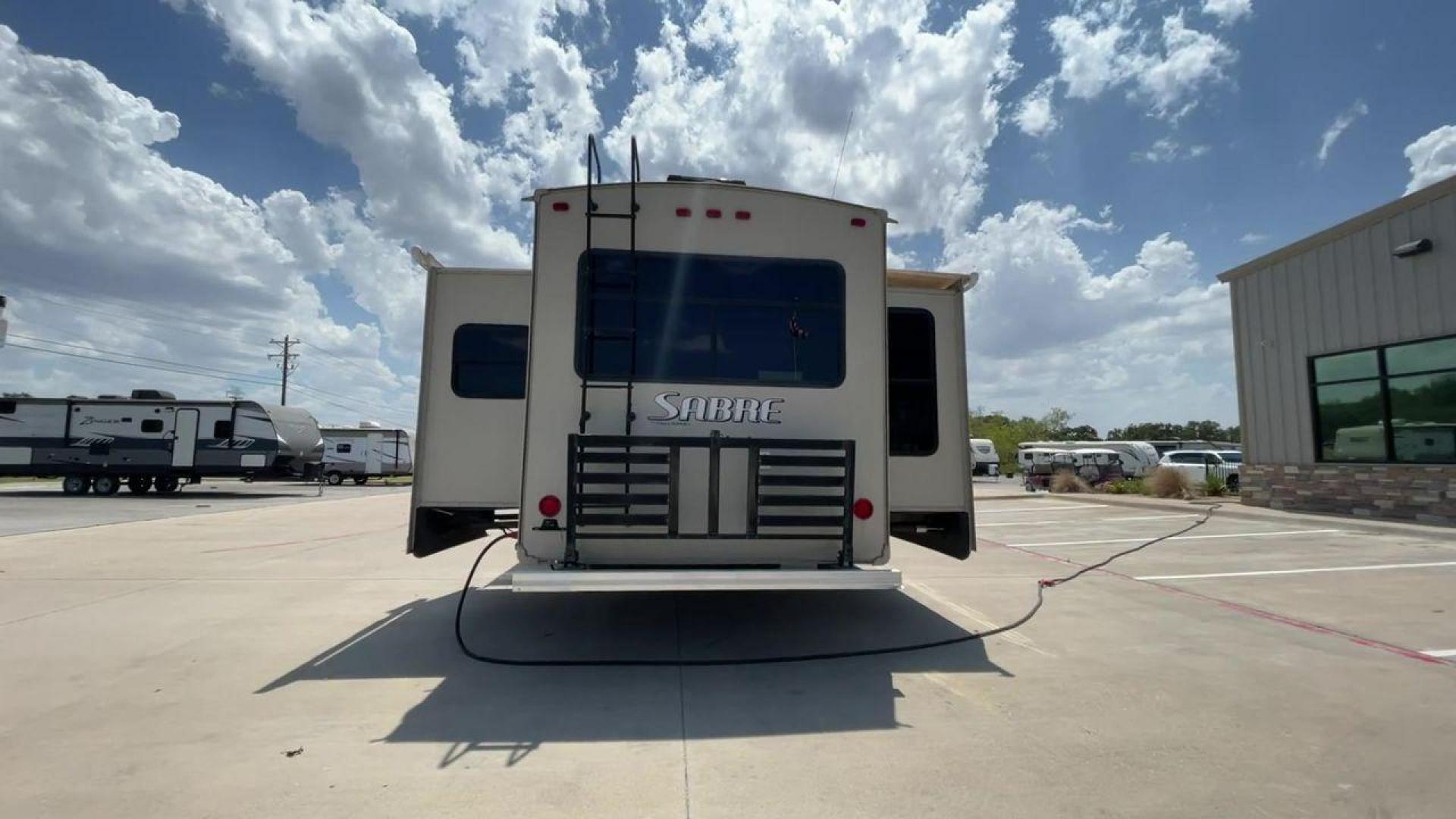 2014 TAN SABRE 34REQS-6 (4X4FSRK2XE3) , Length: 36 ft. | Dry Weight: 10,854 lbs. | Gross Weight: 13,704 lbs. | Slides: 4 transmission, located at 4319 N Main St, Cleburne, TX, 76033, (817) 678-5133, 32.385960, -97.391212 - This RV, which measures 36 feet in length and weighs 10,854 pounds dry, is designed to provide a luxurious and sumptuous living experience when traveling. With a gross weight of 13,704 pounds and four slides, including one in the bedroom, the 2014 Sabre 3REQS-6 Fifth Wheel will allow you plenty of s - Photo#8