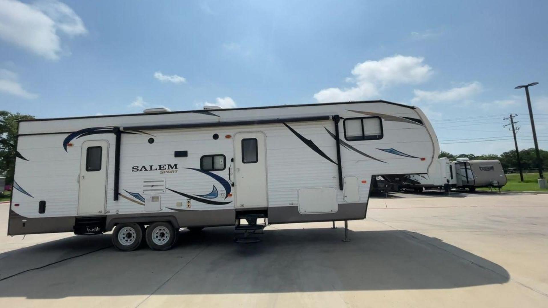 2014 GRAY SALEM 32SRVP - (4X4FSTH29ER) , Length: 34.5 ft. | Dry Weight: 8,198 lbs. | Slides: 1 transmission, located at 4319 N Main St, Cleburne, TX, 76033, (817) 678-5133, 32.385960, -97.391212 - Take advantage of the 2014 Salem 32SRVP Toy Hauler and unleash your sense of adventure. With living space and a designated room for your favorite toys, this tough and adaptable RV is made to fit your outdoor lifestyle. The dimensions of this unit are 34.5 ft in length by 10.08 ft in height. It ha - Photo#2