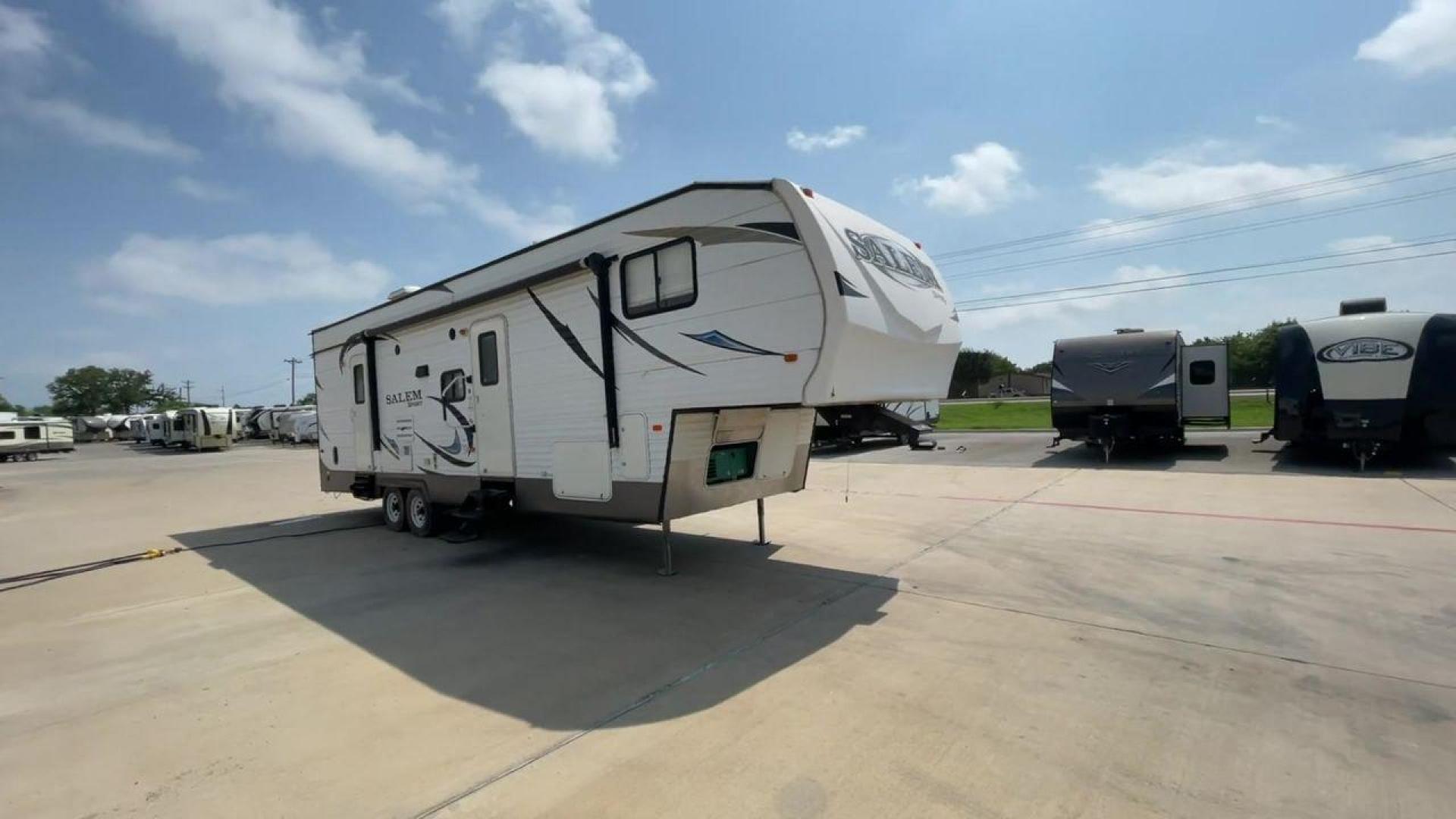 2014 GRAY SALEM 32SRVP - (4X4FSTH29ER) , Length: 34.5 ft. | Dry Weight: 8,198 lbs. | Slides: 1 transmission, located at 4319 N Main St, Cleburne, TX, 76033, (817) 678-5133, 32.385960, -97.391212 - Take advantage of the 2014 Salem 32SRVP Toy Hauler and unleash your sense of adventure. With living space and a designated room for your favorite toys, this tough and adaptable RV is made to fit your outdoor lifestyle. The dimensions of this unit are 34.5 ft in length by 10.08 ft in height. It ha - Photo#3