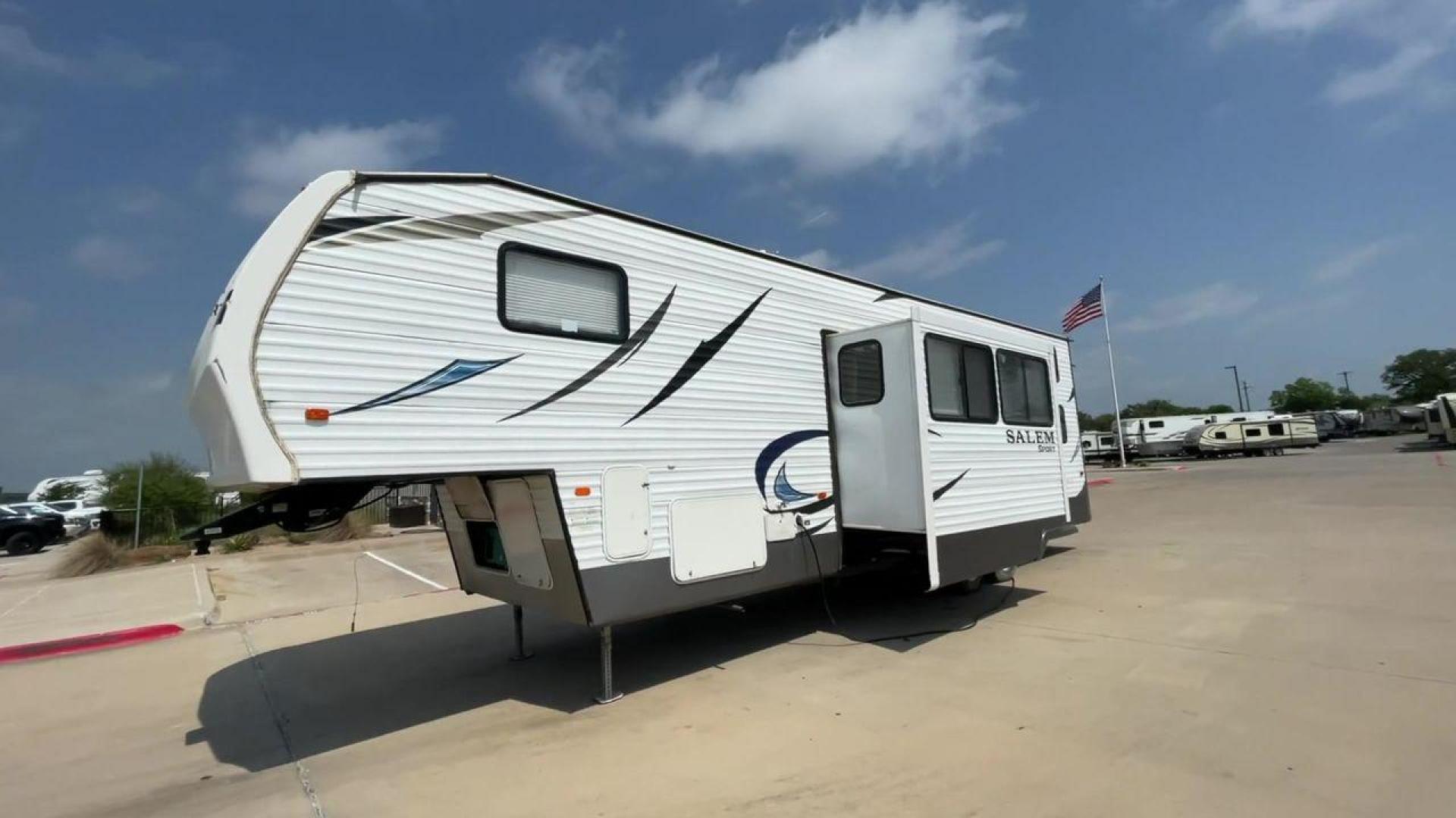 2014 GRAY SALEM 32SRVP - (4X4FSTH29ER) , Length: 34.5 ft. | Dry Weight: 8,198 lbs. | Slides: 1 transmission, located at 4319 N Main St, Cleburne, TX, 76033, (817) 678-5133, 32.385960, -97.391212 - Take advantage of the 2014 Salem 32SRVP Toy Hauler and unleash your sense of adventure. With living space and a designated room for your favorite toys, this tough and adaptable RV is made to fit your outdoor lifestyle. The dimensions of this unit are 34.5 ft in length by 10.08 ft in height. It ha - Photo#5