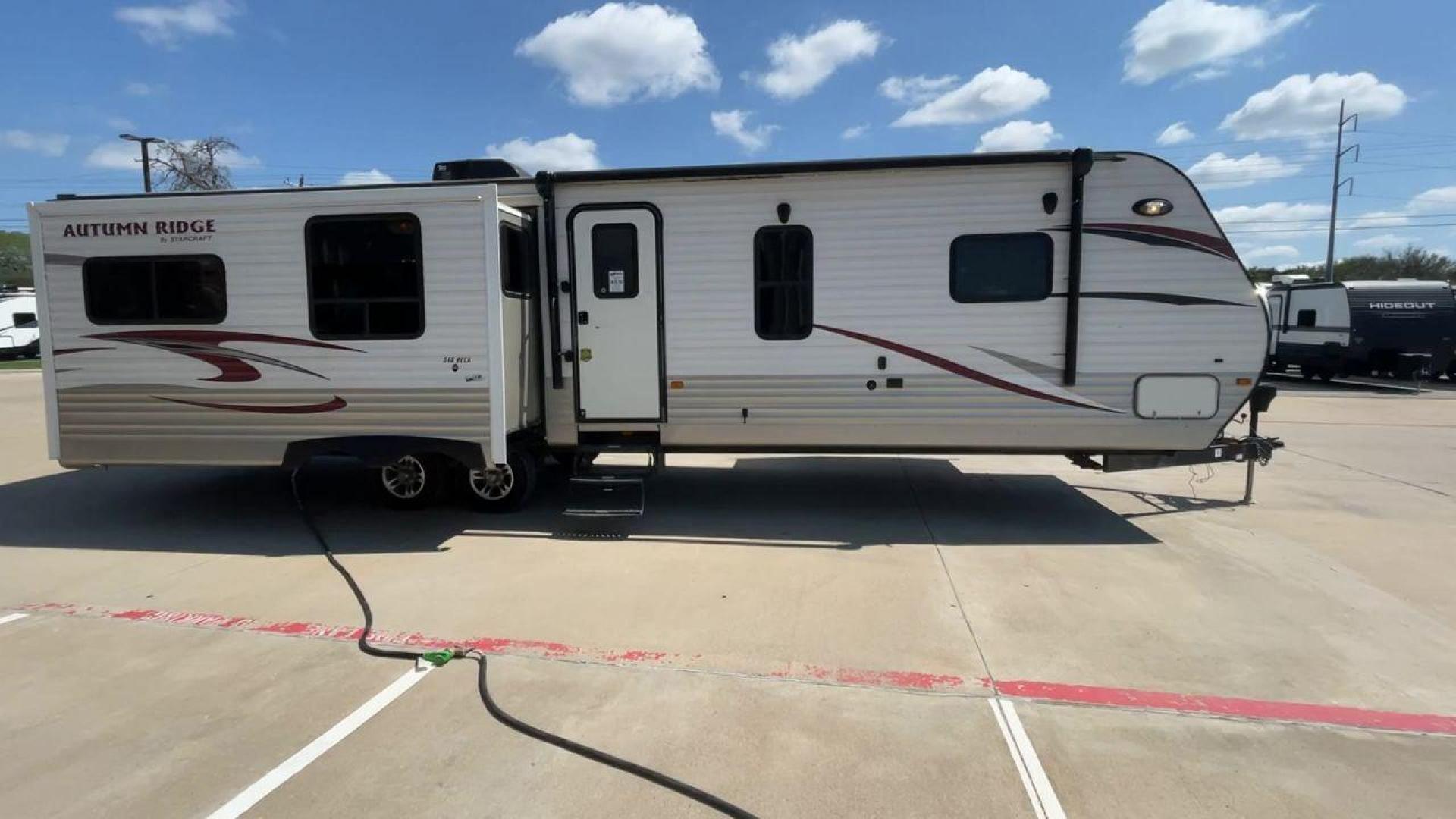 2014 WHITE STARCRAFT AUTUMN RIDGE346 RESA (1SABS0BU0E2) , Length: 38.25 ft. | Dry Weight: 8,385 lbs. | Gross Weight: 10,750 lbs. | Slides: 3 transmission, located at 4319 N Main St, Cleburne, TX, 76033, (817) 678-5133, 32.385960, -97.391212 - With the 2014 Starcraft Autumn Ridge 346RESA travel trailer, you can unleash your inner explorer. For your outdoor adventures, this finely built and feature-rich RV is intended to bring you a cozy and delightful home away from home. This trailer has dimensions of 38.25 ft in length, 8 ft in width, a - Photo#2