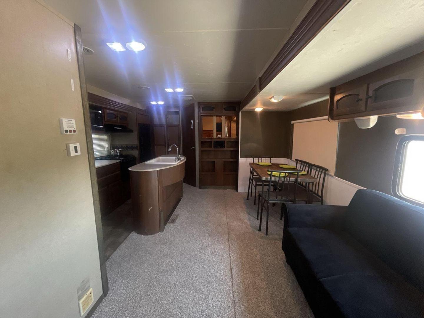 2015 TAN COACHMEN FREEDOM EXPRESS 320D (5ZT2FEXB6FA) , Length: 36.92 ft | Dry Weight: 7,374 lbs | Gross Weight: 10,700 lbs | Slides: 3 transmission, located at 4319 N Main St, Cleburne, TX, 76033, (817) 678-5133, 32.385960, -97.391212 - Photo#11