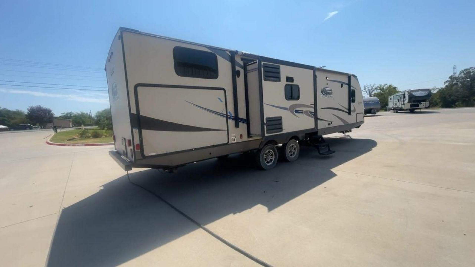 2015 TAN COACHMEN FREEDOM EXPRESS 320D (5ZT2FEXB6FA) , Length: 36.92 ft | Dry Weight: 7,374 lbs | Gross Weight: 10,700 lbs | Slides: 3 transmission, located at 4319 N Main St, Cleburne, TX, 76033, (817) 678-5133, 32.385960, -97.391212 - Photo#1