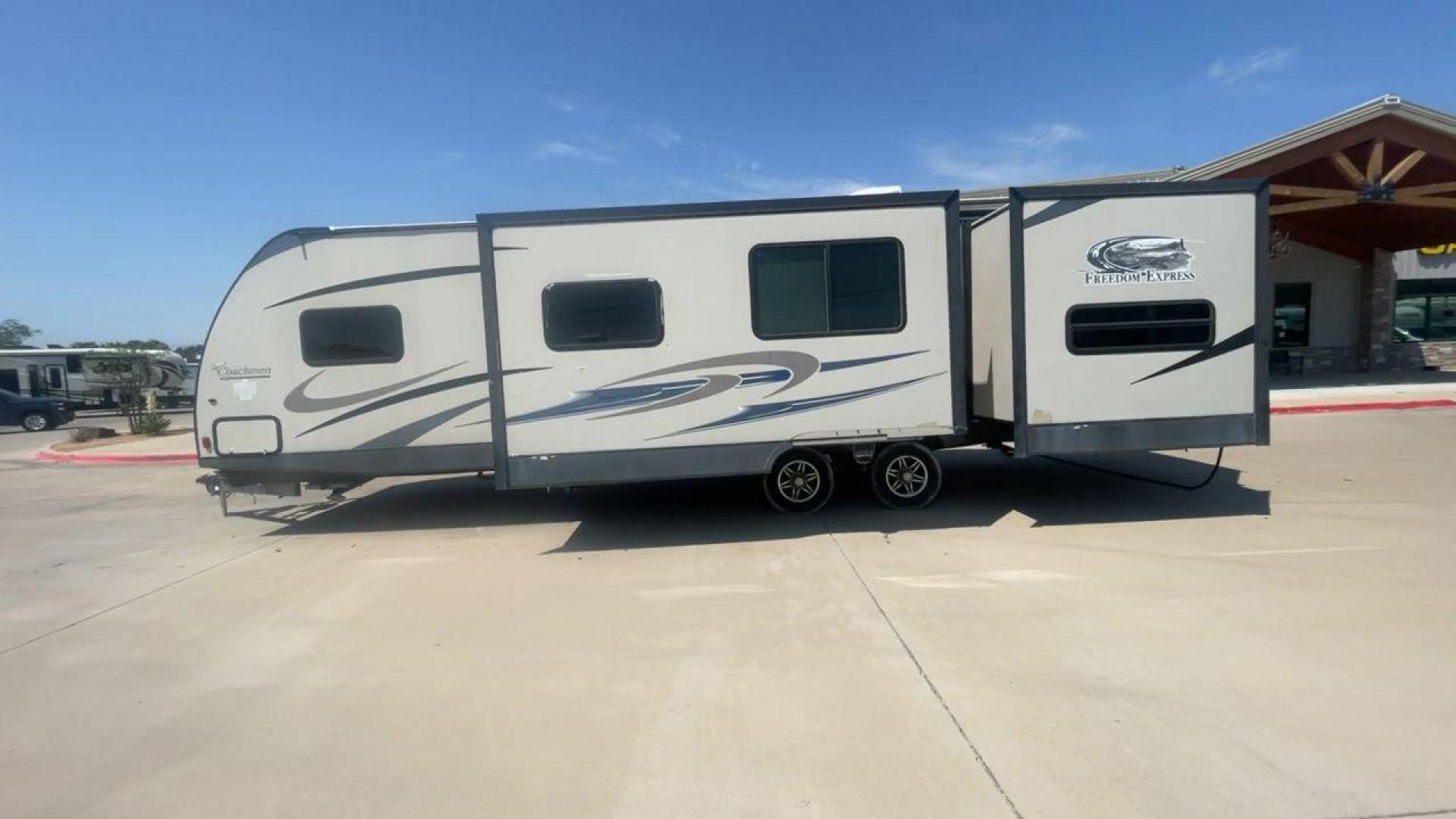 2015 TAN COACHMEN FREEDOM EXPRESS 320D (5ZT2FEXB6FA) , Length: 36.92 ft | Dry Weight: 7,374 lbs | Gross Weight: 10,700 lbs | Slides: 3 transmission, located at 4319 N Main St, Cleburne, TX, 76033, (817) 678-5133, 32.385960, -97.391212 - Photo#6