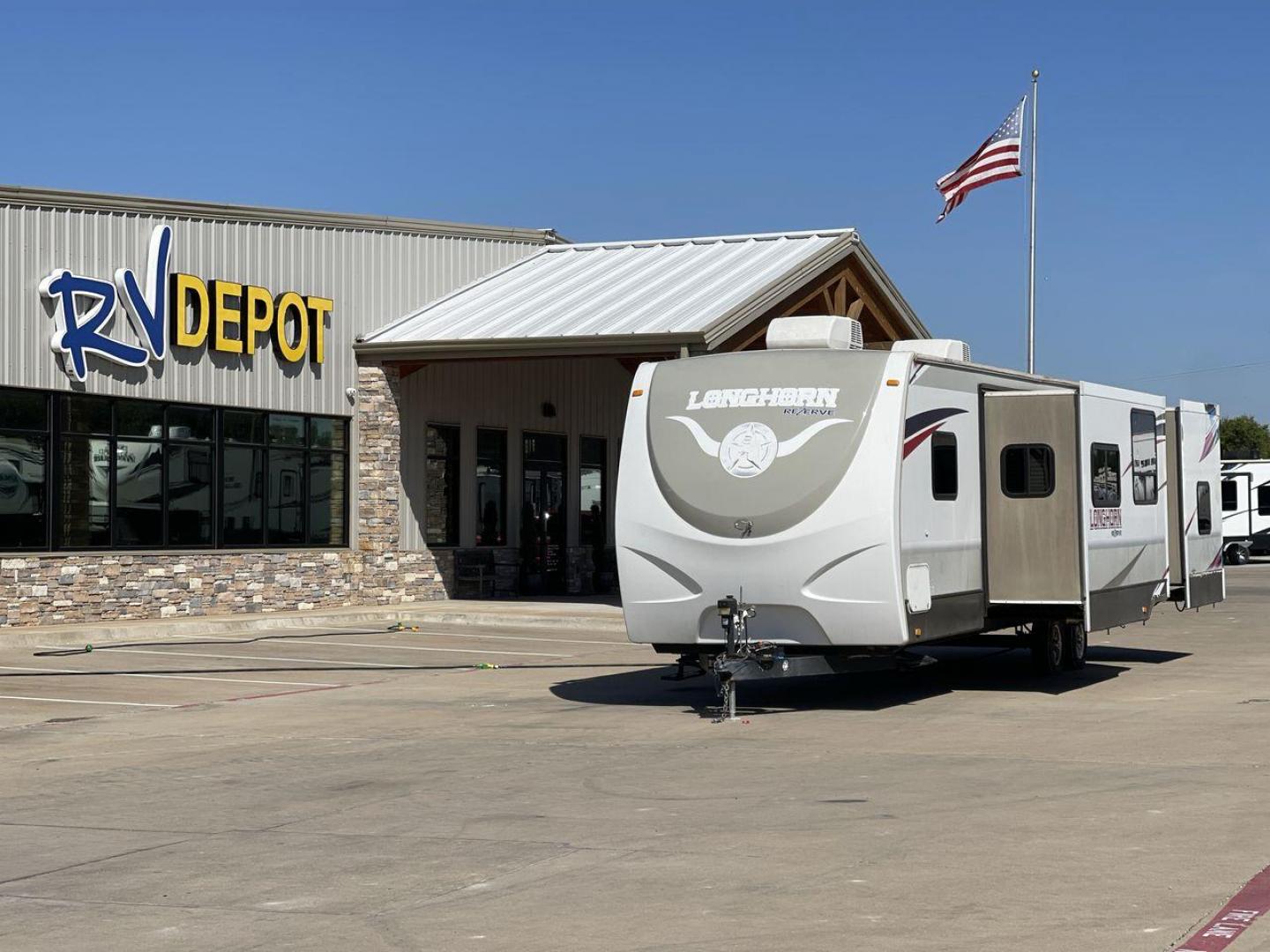 2015 CROSSROADS LONGHORN 31SB (4V0TC3124FE) , Length: 35.5 ft. | Dry Weight: 7,875 lbs. | Gross Weight: 9,671 lbs. | Slides: 2 transmission, located at 4319 N Main St, Cleburne, TX, 76033, (817) 678-5133, 32.385960, -97.391212 - The 2015 Crossroads Longhorn 31SB is a well-crafted travel trailer with thoughtful design features and ample space, making it a great choice for families or groups looking for comfort on the road. The exterior of the Crossroads Longhorn 31SB is sleek and modern with a white body and tasteful accents - Photo#0