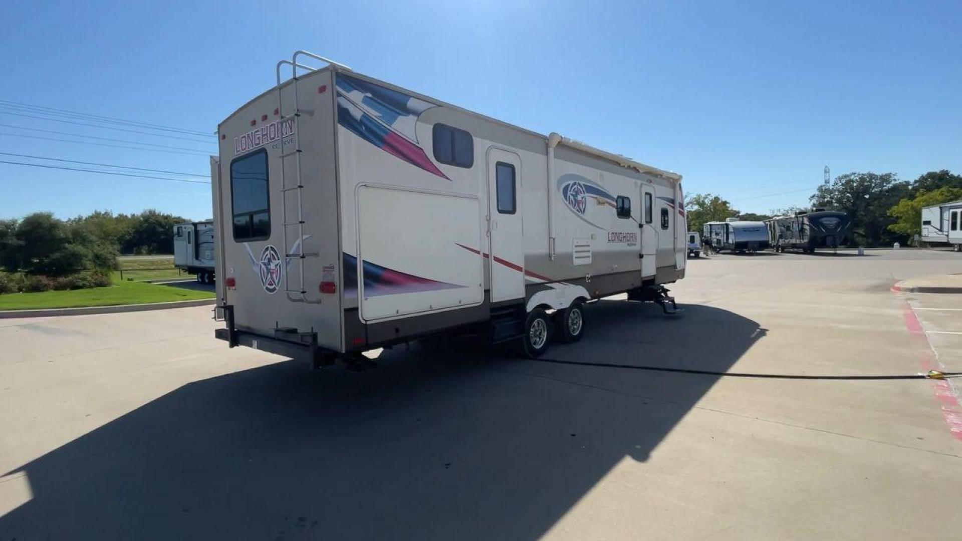 2015 CROSSROADS LONGHORN 31SB (4V0TC3124FE) , Length: 35.5 ft. | Dry Weight: 7,875 lbs. | Gross Weight: 9,671 lbs. | Slides: 2 transmission, located at 4319 N Main St, Cleburne, TX, 76033, (817) 678-5133, 32.385960, -97.391212 - The 2015 Crossroads Longhorn 31SB is a well-crafted travel trailer with thoughtful design features and ample space, making it a great choice for families or groups looking for comfort on the road. The exterior of the Crossroads Longhorn 31SB is sleek and modern with a white body and tasteful accents - Photo#1