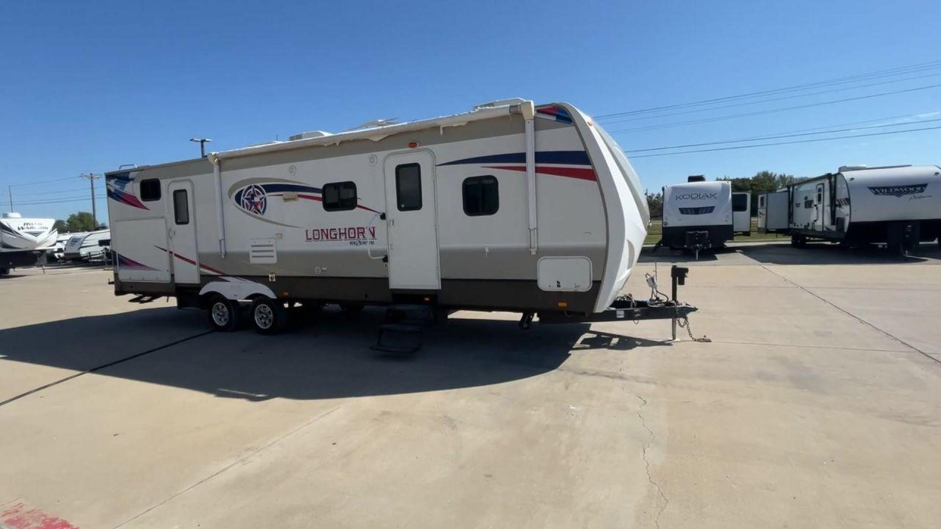 2015 CROSSROADS LONGHORN 31SB (4V0TC3124FE) , Length: 35.5 ft. | Dry Weight: 7,875 lbs. | Gross Weight: 9,671 lbs. | Slides: 2 transmission, located at 4319 N Main St, Cleburne, TX, 76033, (817) 678-5133, 32.385960, -97.391212 - The 2015 Crossroads Longhorn 31SB is a well-crafted travel trailer with thoughtful design features and ample space, making it a great choice for families or groups looking for comfort on the road. The exterior of the Crossroads Longhorn 31SB is sleek and modern with a white body and tasteful accents - Photo#3