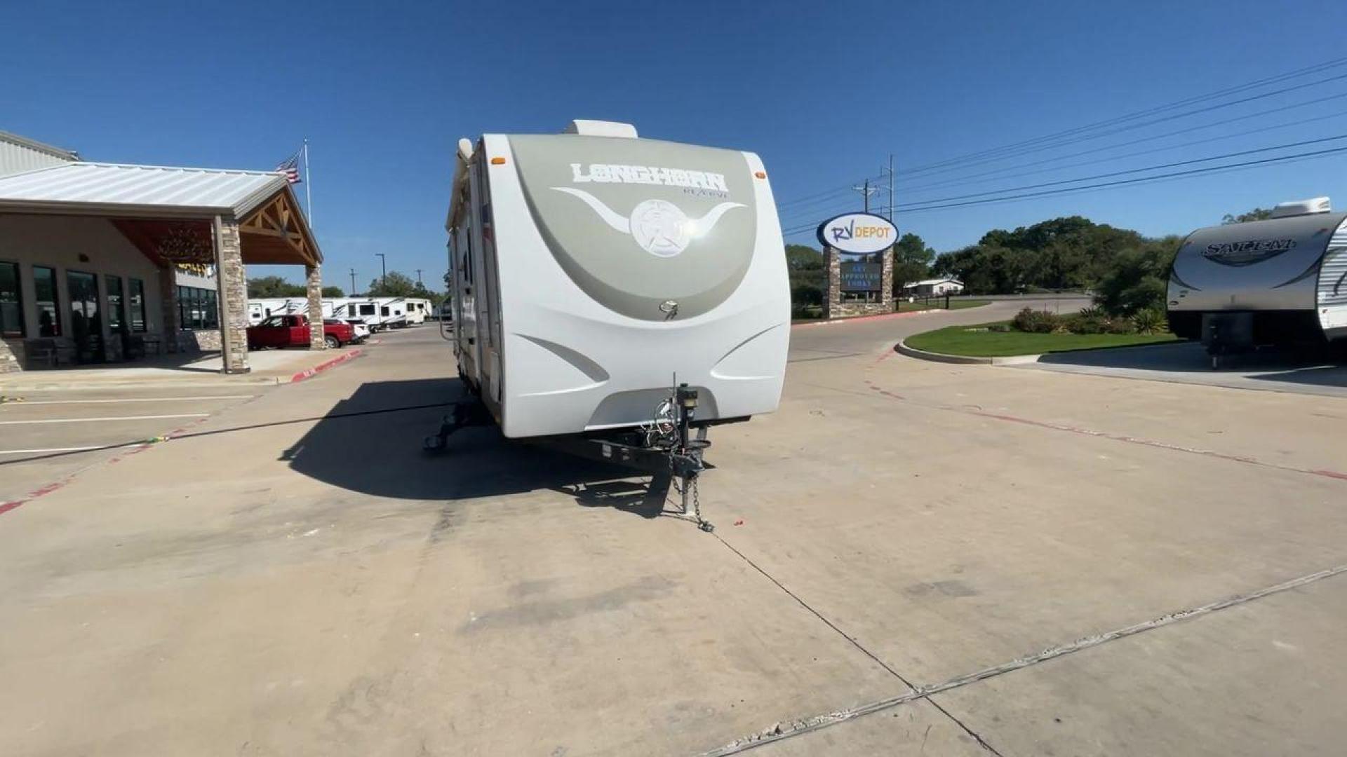 2015 CROSSROADS LONGHORN 31SB (4V0TC3124FE) , Length: 35.5 ft. | Dry Weight: 7,875 lbs. | Gross Weight: 9,671 lbs. | Slides: 2 transmission, located at 4319 N Main St, Cleburne, TX, 76033, (817) 678-5133, 32.385960, -97.391212 - The 2015 Crossroads Longhorn 31SB is a well-crafted travel trailer with thoughtful design features and ample space, making it a great choice for families or groups looking for comfort on the road. The exterior of the Crossroads Longhorn 31SB is sleek and modern with a white body and tasteful accents - Photo#4