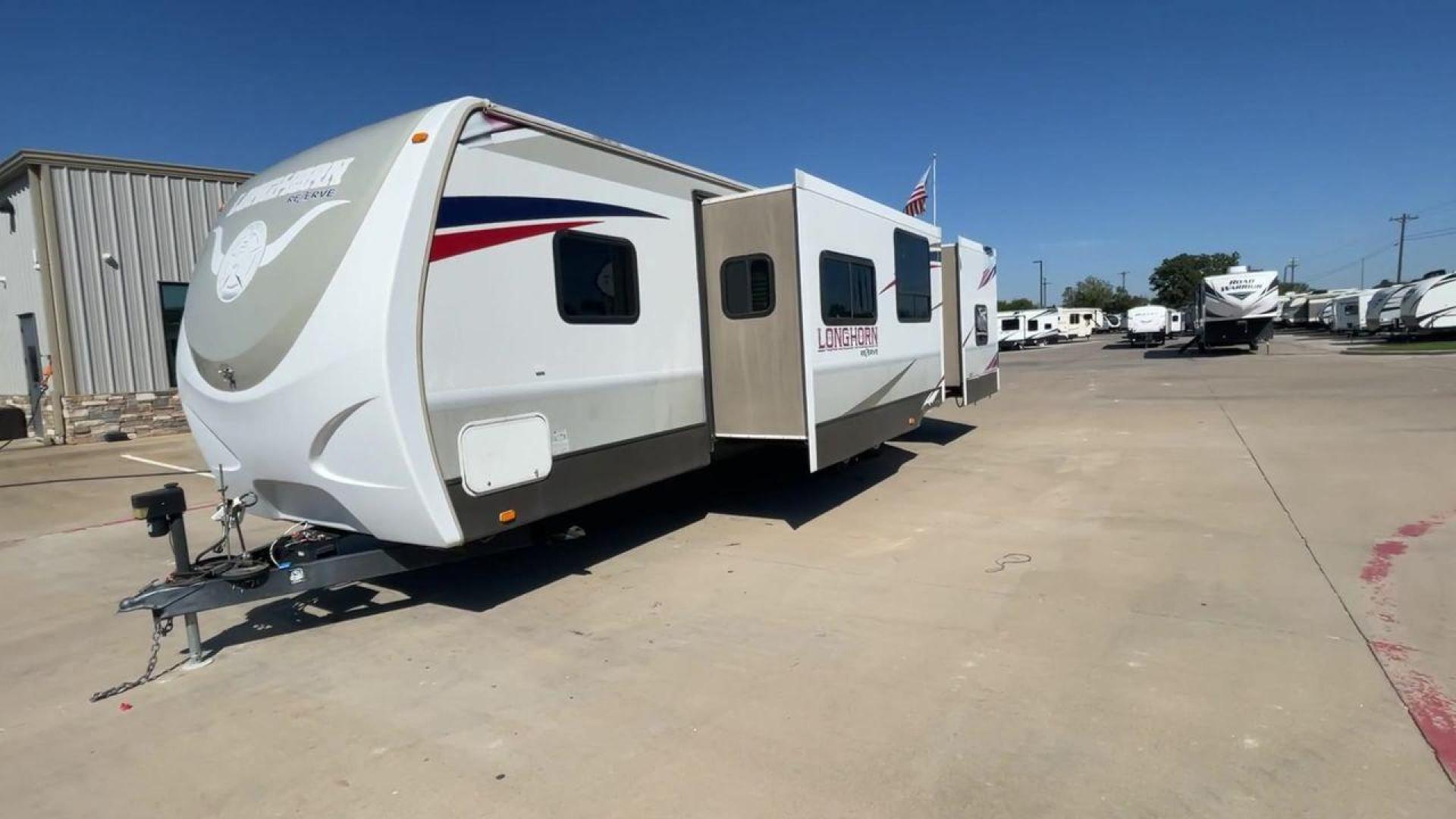 2015 CROSSROADS LONGHORN 31SB (4V0TC3124FE) , Length: 35.5 ft. | Dry Weight: 7,875 lbs. | Gross Weight: 9,671 lbs. | Slides: 2 transmission, located at 4319 N Main St, Cleburne, TX, 76033, (817) 678-5133, 32.385960, -97.391212 - The 2015 Crossroads Longhorn 31SB is a well-crafted travel trailer with thoughtful design features and ample space, making it a great choice for families or groups looking for comfort on the road. The exterior of the Crossroads Longhorn 31SB is sleek and modern with a white body and tasteful accents - Photo#5