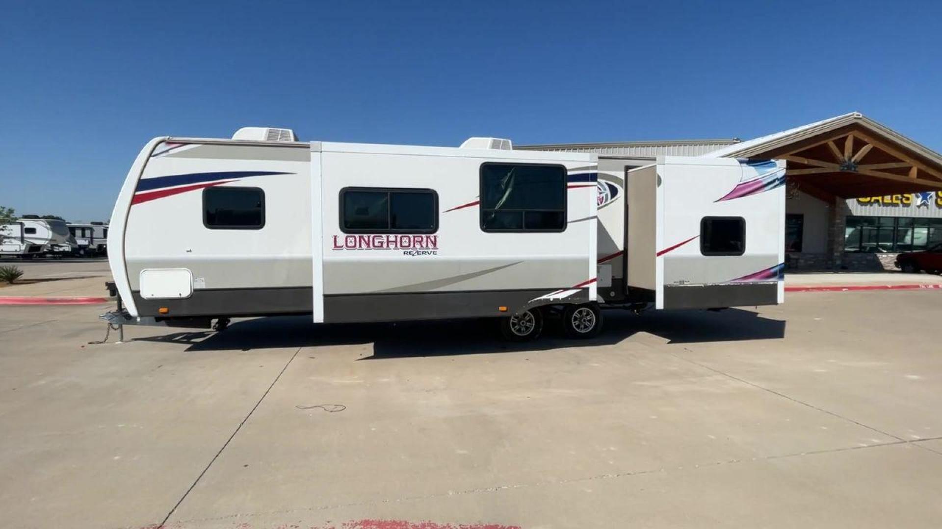 2015 CROSSROADS LONGHORN 31SB (4V0TC3124FE) , Length: 35.5 ft. | Dry Weight: 7,875 lbs. | Gross Weight: 9,671 lbs. | Slides: 2 transmission, located at 4319 N Main St, Cleburne, TX, 76033, (817) 678-5133, 32.385960, -97.391212 - The 2015 Crossroads Longhorn 31SB is a well-crafted travel trailer with thoughtful design features and ample space, making it a great choice for families or groups looking for comfort on the road. The exterior of the Crossroads Longhorn 31SB is sleek and modern with a white body and tasteful accents - Photo#6