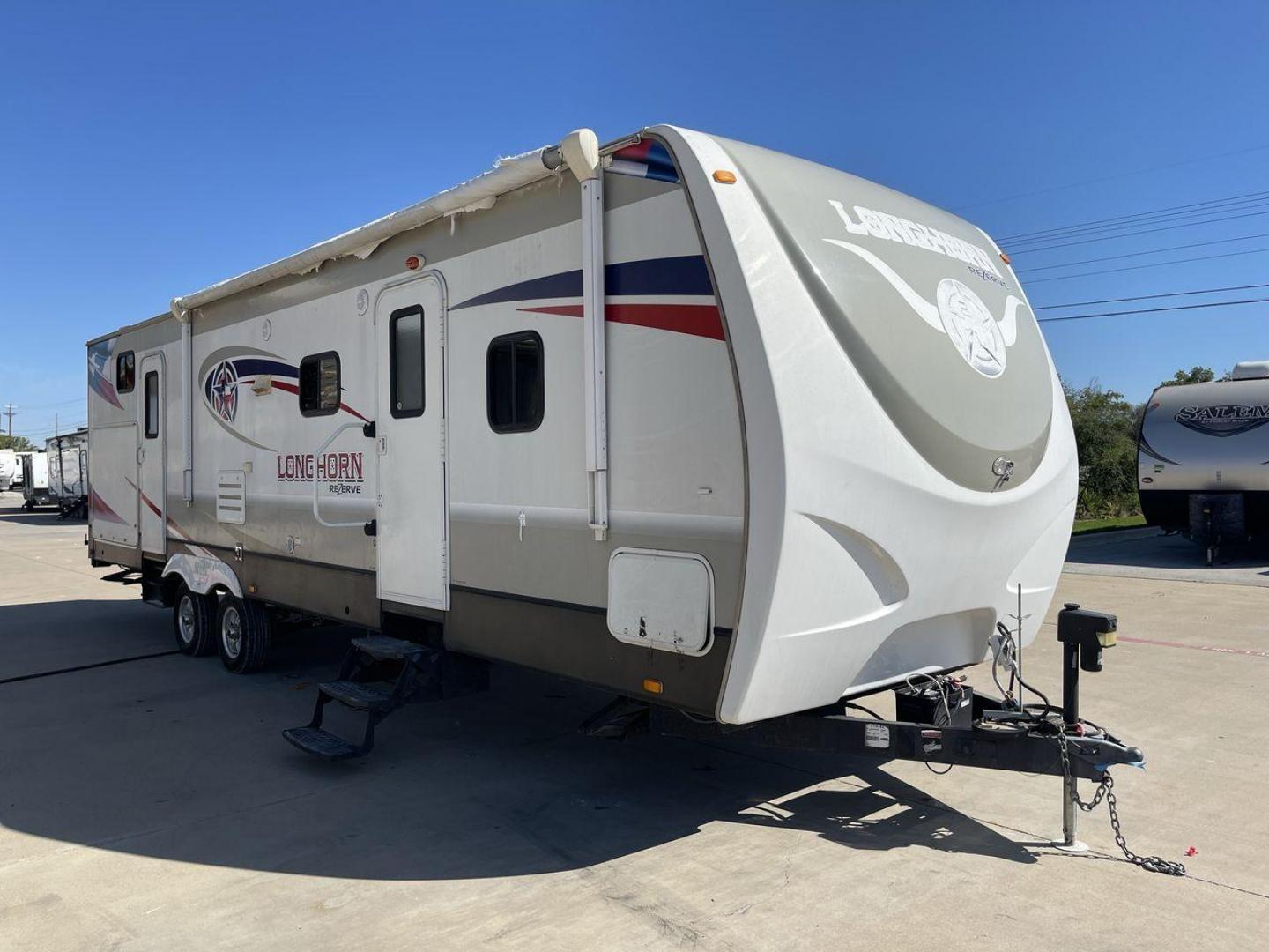 2015 CROSSROADS LONGHORN 31SB (4V0TC3124FE) , Length: 35.5 ft. | Dry Weight: 7,875 lbs. | Gross Weight: 9,671 lbs. | Slides: 2 transmission, located at 4319 N Main St, Cleburne, TX, 76033, (817) 678-5133, 32.385960, -97.391212 - The 2015 Crossroads Longhorn 31SB is a well-crafted travel trailer with thoughtful design features and ample space, making it a great choice for families or groups looking for comfort on the road. The exterior of the Crossroads Longhorn 31SB is sleek and modern with a white body and tasteful accents - Photo#21