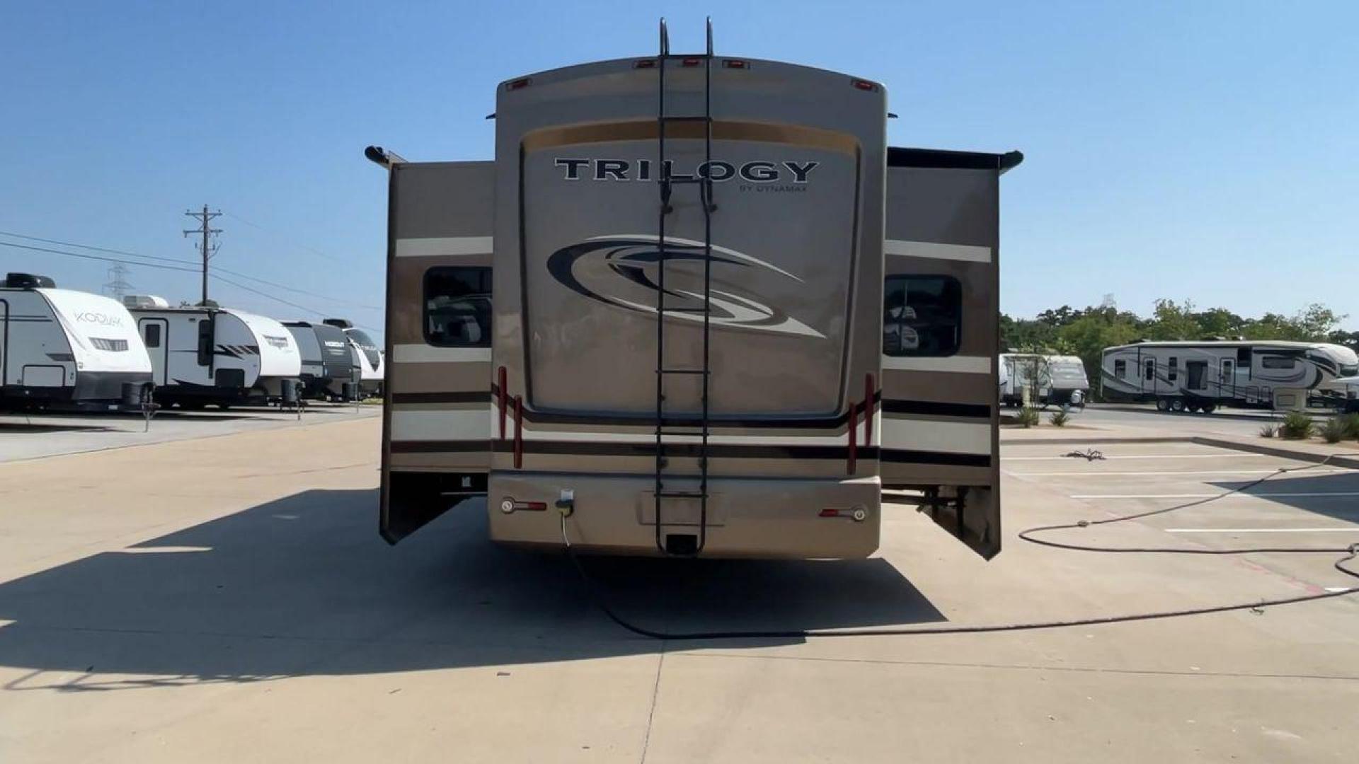 2015 TAN DYNAMAX TRILOGY 37BH - (5ZT3TL2B8FC) , Length: 42 ft. | Dry Weight: 15,638 lbs. | Gross Weight: 18,550 lbs. | Slides: 5 transmission, located at 4319 N Main St, Cleburne, TX, 76033, (817) 678-5133, 32.385960, -97.391212 - Photo#8