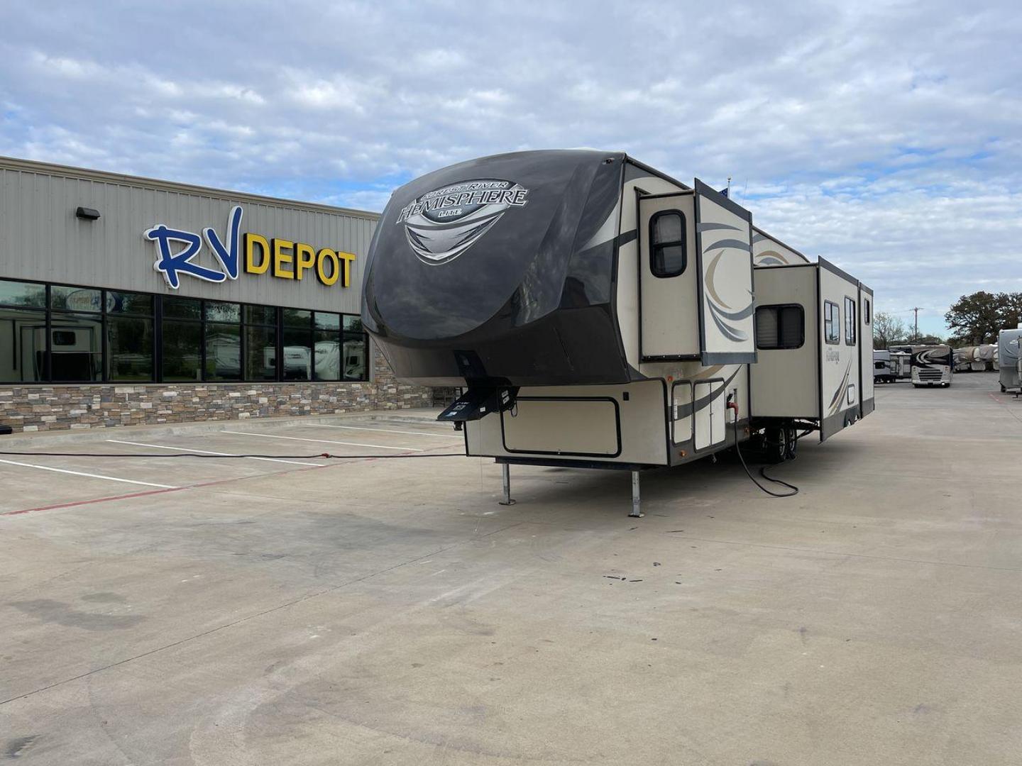 2015 TAN FOREST RIVER HEMISPHERE (4X4FSBM2XFU) , Length: 42.25 ft. | Dry Weight: 10,960 lbs. | Slides: 4 transmission, located at 4319 N Main St, Cleburne, TX, 76033, (817) 678-5133, 32.385960, -97.391212 - If you're in the market for a high-quality fifth wheel bunk house, look no further than this 2015 FOREST RIVER HEMISPHERE currently for sale at RV Depot in Cleburne, TX. With its affordable price of $32,995, this RV is a steal for anyone looking to hit the open road in style. Located in Cleburne, T - Photo#0