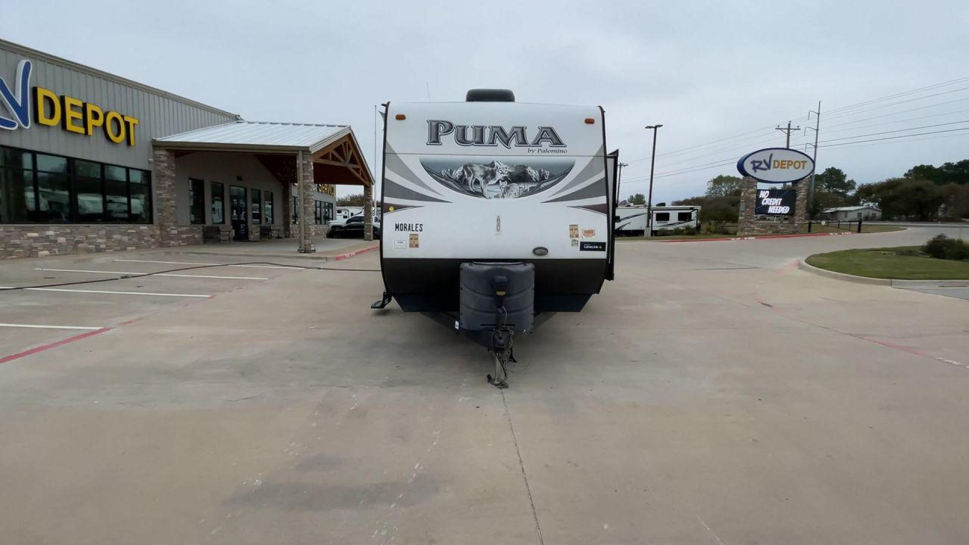 2015 FOREST RIVER PUMA 31BHSS (4X4TPUG21FP) , Length: 35.33 ft. | Dry Weight: 7,702 lbs. | Gross Weight: 10,236 lbs. | Slides: 2 transmission, located at 4319 N Main St, Cleburne, TX, 76033, (817) 678-5133, 32.385960, -97.391212 - The 2015 Forest River Puma 31BH RV features a classic and durable exterior design. The body of the RV is a combination of gray, white, and black with accents of maroon, which gives it a rugged yet stylish look. The sides have aluminum panels with a ribbed texture, which not only adds to the aestheti - Photo#4