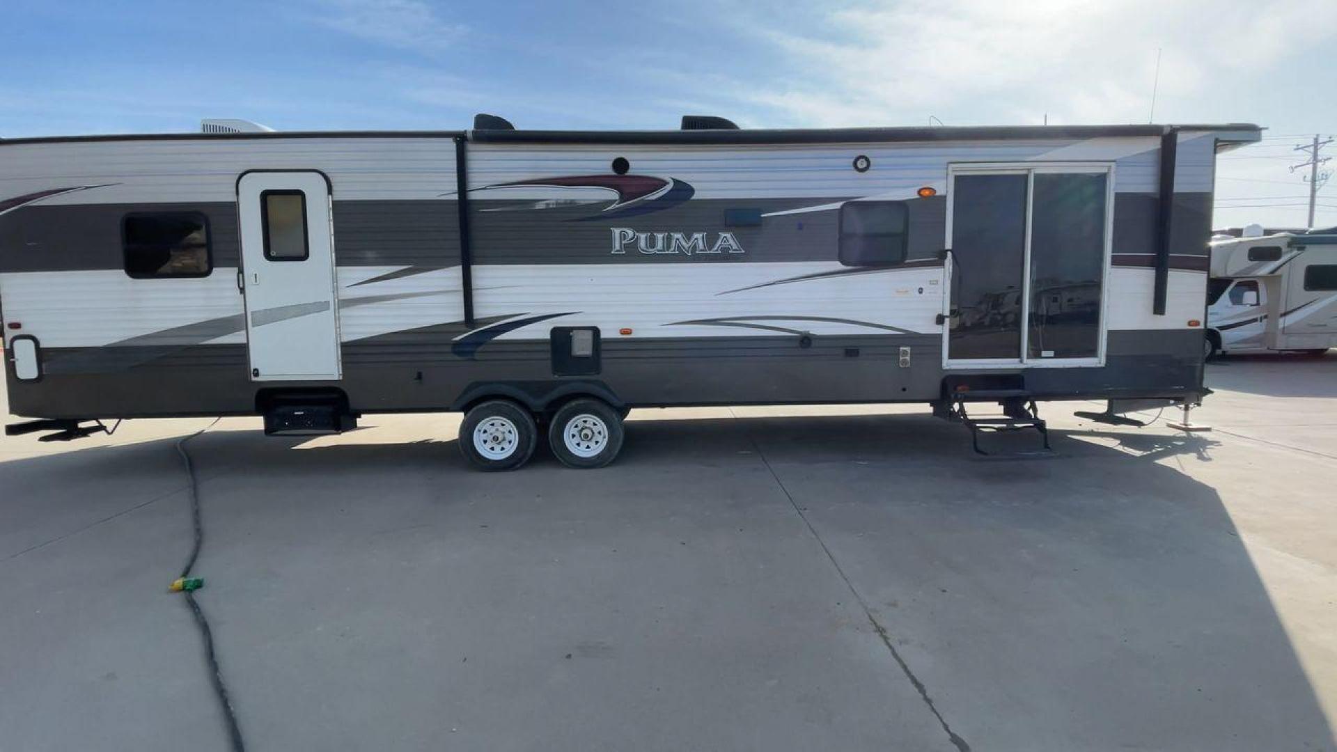 2015 FOREST RIVER PUMA 38PLF (4X4TPUP29FP) , Length: 40.83 ft. | Dry Weight: 9,565 lbs. | Gross Weight: 12,099 lbs. | Slides: 2 transmission, located at 4319 N Main St, Cleburne, TX, 76033, (817) 678-5133, 32.385960, -97.391212 - The 2015 Forest River Puma 38PLF is a spacious destination trailer designed for those who desire the comforts of home while enjoying the great outdoors. With a residential-style layout and thoughtful features, it’s perfect for extended stays or seasonal living. This unit has a length of 40.83 ft i - Photo#2