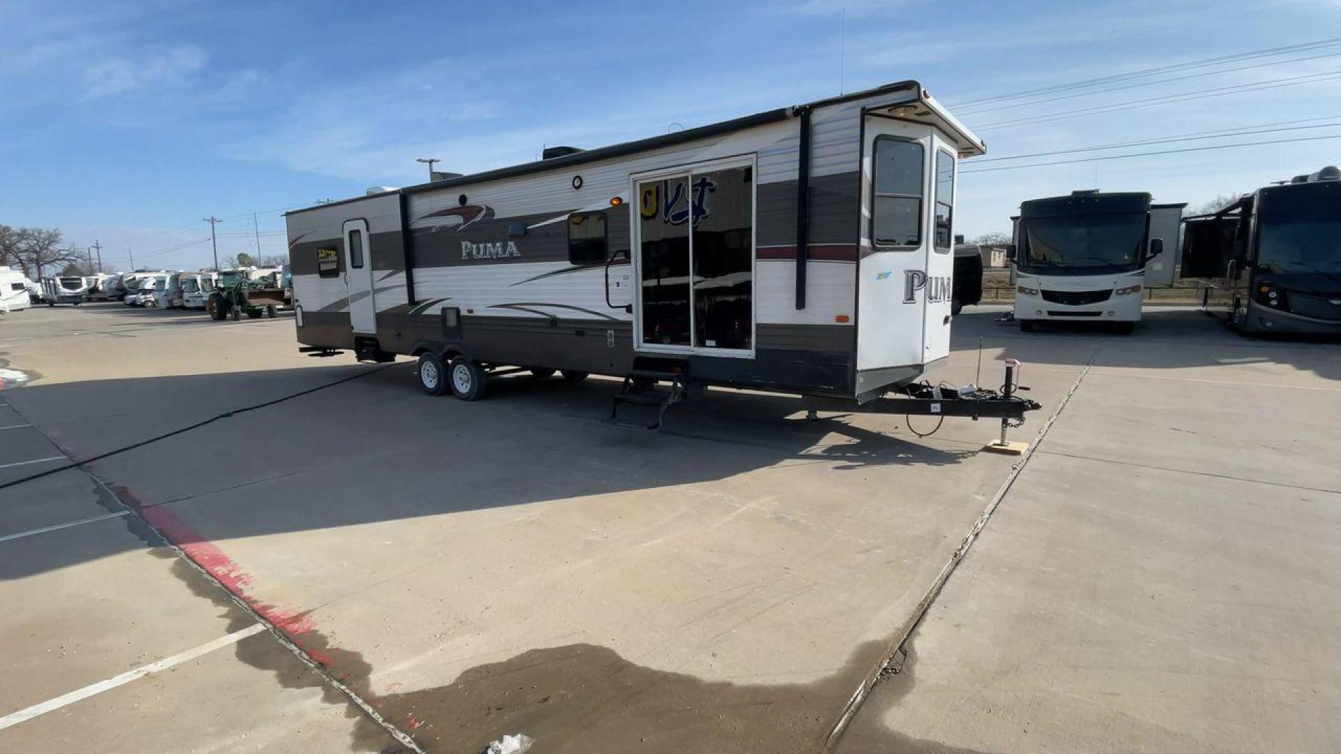 2015 FOREST RIVER PUMA 38PLF (4X4TPUP29FP) , Length: 40.83 ft. | Dry Weight: 9,565 lbs. | Gross Weight: 12,099 lbs. | Slides: 2 transmission, located at 4319 N Main St, Cleburne, TX, 76033, (817) 678-5133, 32.385960, -97.391212 - The 2015 Forest River Puma 38PLF is a spacious destination trailer designed for those who desire the comforts of home while enjoying the great outdoors. With a residential-style layout and thoughtful features, it’s perfect for extended stays or seasonal living. This unit has a length of 40.83 ft i - Photo#3