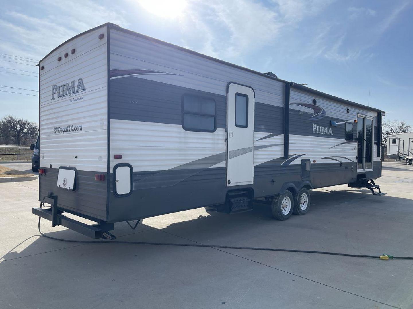 2015 FOREST RIVER PUMA 38PLF (4X4TPUP29FP) , Length: 40.83 ft. | Dry Weight: 9,565 lbs. | Gross Weight: 12,099 lbs. | Slides: 2 transmission, located at 4319 N Main St, Cleburne, TX, 76033, (817) 678-5133, 32.385960, -97.391212 - The 2015 Forest River Puma 38PLF is a spacious destination trailer designed for those who desire the comforts of home while enjoying the great outdoors. With a residential-style layout and thoughtful features, it’s perfect for extended stays or seasonal living. This unit has a length of 40.83 ft i - Photo#24