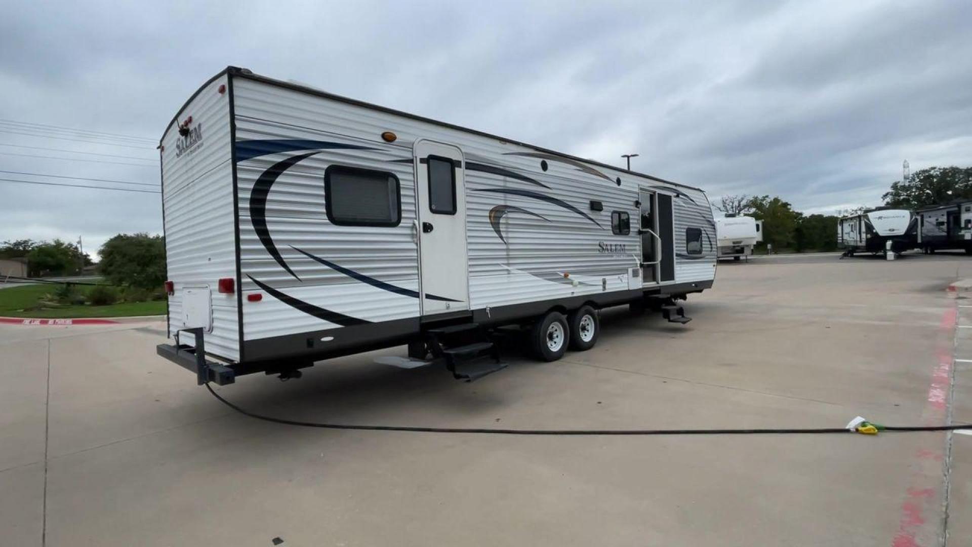 2015 FOREST RIVER SALEM 36BHBS (4X4TSMM24FA) , Length: 36.58 ft. | Dry Weight: 7,892 lbs. | Slides: 2 transmission, located at 4319 N Main St, Cleburne, TX, 76033, (817) 678-5133, 32.385960, -97.391212 - The 2015 Forest River Salem 36BHBS is a spacious and versatile travel trailer designed for comfort and convenience during family adventures. With a length of 36.58 feet and a dry weight of 7,892 lbs., this model offers ample living space and features that make it perfect for long vacations or weeken - Photo#1