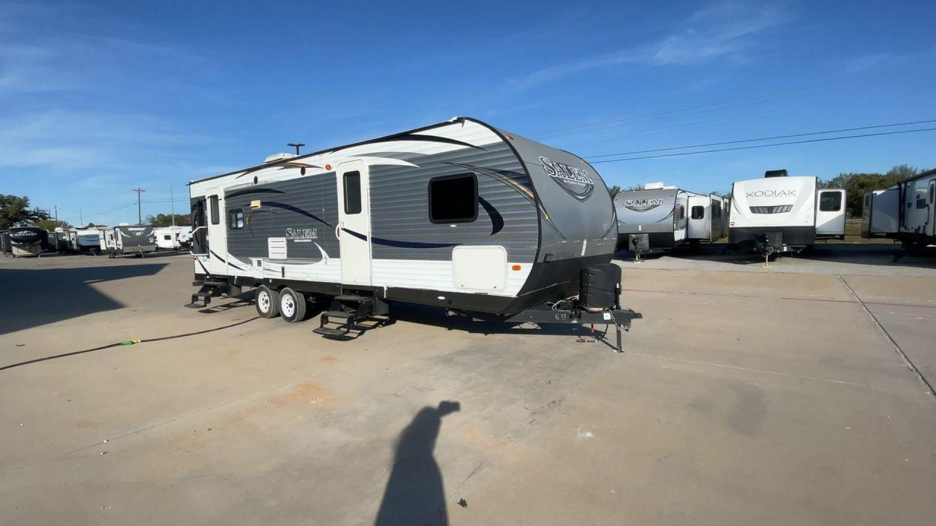 2015 GRAY FOREST RIVER SALEM - (4X4TSMD2XFA) , Length: 31.67 ft. | Dry Weight: 7,394 lbs. | Slides: 2 transmission, located at 4319 N Main St, Cleburne, TX, 76033, (817) 678-5133, 32.385960, -97.391212 - RV Depot in Cleburne, TX is offering a fantastic deal on a 2015 FOREST RIVER SALEM travel trailer. Priced at just $27,995, this spacious and comfortable RV is perfect for those looking to hit the road and explore the local driving highlights around Cleburne, TX. The exterior of this travel trailer - Photo#3