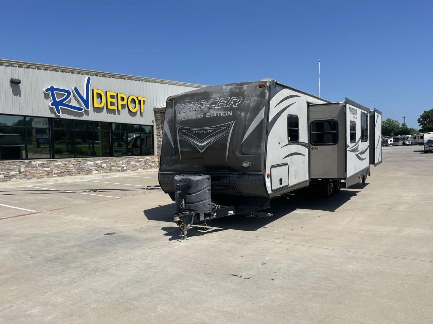 2015 WHITE FOREST RIVER TRACER 3150BHD (5ZT2TRXB5FB) , Length: 34 ft. | Dry Weight: 6,955 lbs. | Slides: 2 transmission, located at 4319 N Main St, Cleburne, TX, 76033, (817) 678-5133, 32.385960, -97.391212 - In this 2015 Forest River Tracer 3150BHD, you are guaranteed more campers, more features, and more fun! This travel trailer measures exactly 34 ft. in length with a dry weight of 6,955 lbs. and a payload capacity of 2,755 lbs. It includes two doors, two slides, and one awning. This model featu - Photo#0