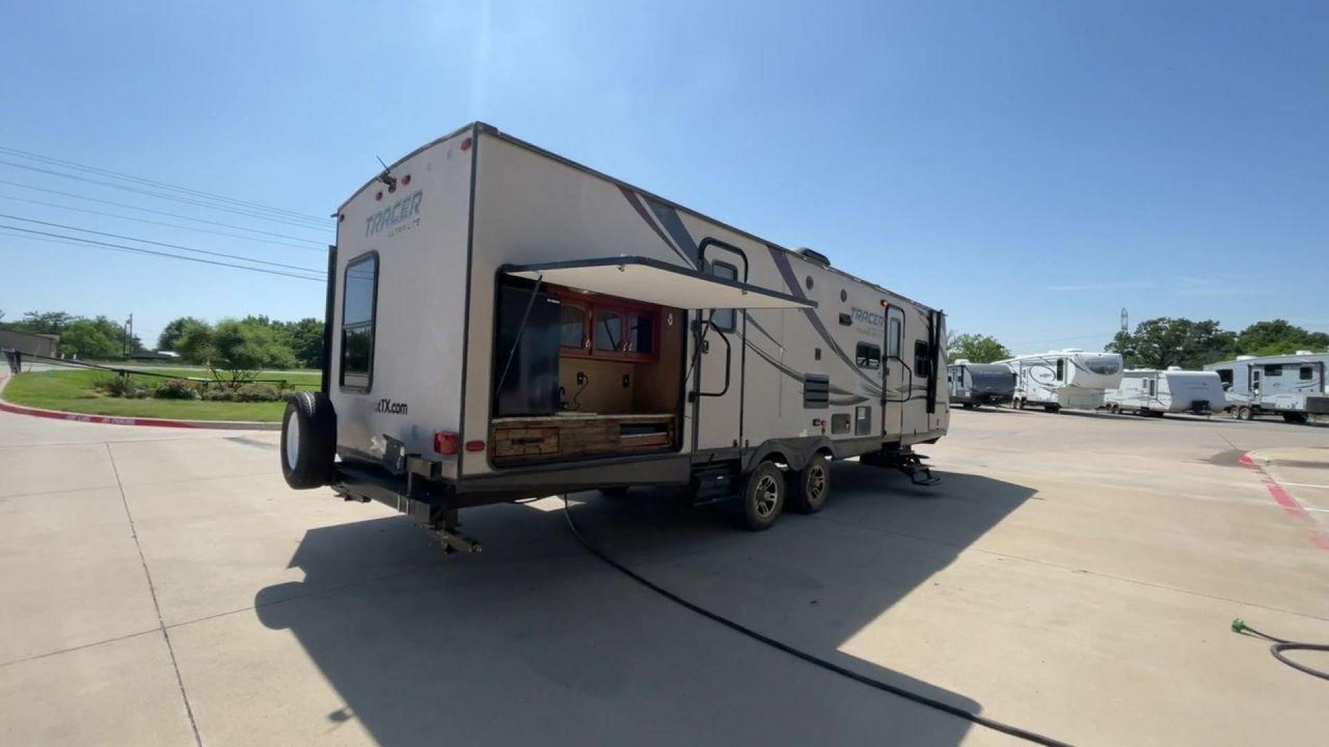 2015 WHITE FOREST RIVER TRACER 3150BHD (5ZT2TRXB5FB) , Length: 34 ft. | Dry Weight: 6,955 lbs. | Slides: 2 transmission, located at 4319 N Main St, Cleburne, TX, 76033, (817) 678-5133, 32.385960, -97.391212 - In this 2015 Forest River Tracer 3150BHD, you are guaranteed more campers, more features, and more fun! This travel trailer measures exactly 34 ft. in length with a dry weight of 6,955 lbs. and a payload capacity of 2,755 lbs. It includes two doors, two slides, and one awning. This model featu - Photo#1