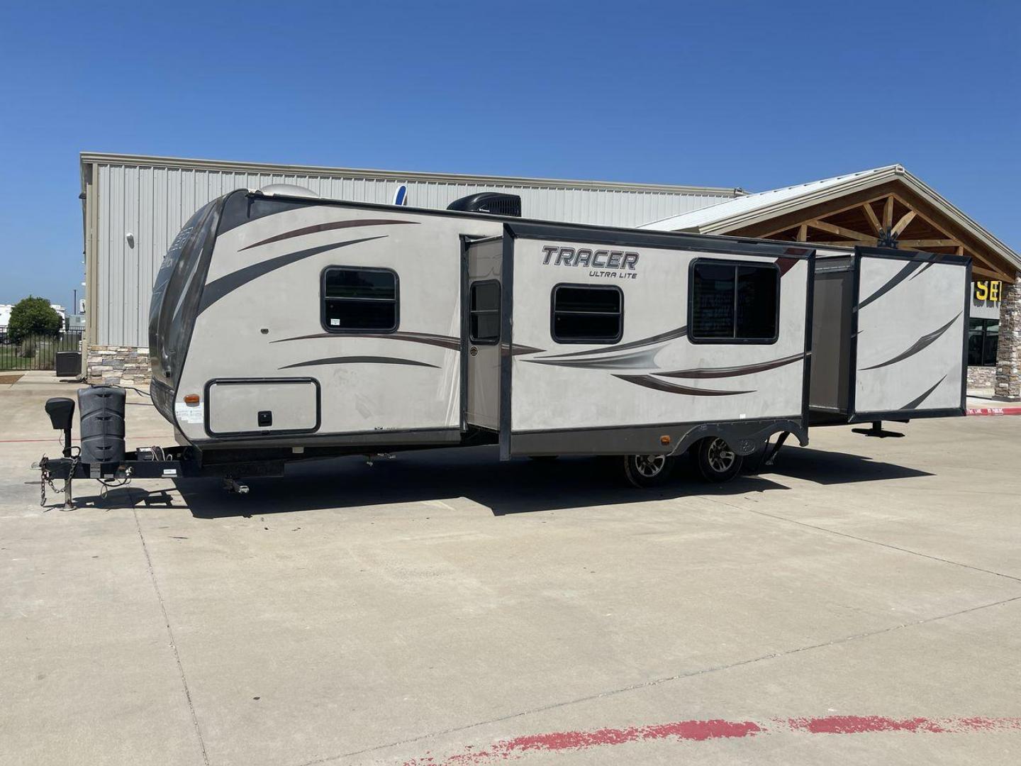 2015 WHITE FOREST RIVER TRACER 3150BHD (5ZT2TRXB5FB) , Length: 34 ft. | Dry Weight: 6,955 lbs. | Slides: 2 transmission, located at 4319 N Main St, Cleburne, TX, 76033, (817) 678-5133, 32.385960, -97.391212 - In this 2015 Forest River Tracer 3150BHD, you are guaranteed more campers, more features, and more fun! This travel trailer measures exactly 34 ft. in length with a dry weight of 6,955 lbs. and a payload capacity of 2,755 lbs. It includes two doors, two slides, and one awning. This model featu - Photo#25