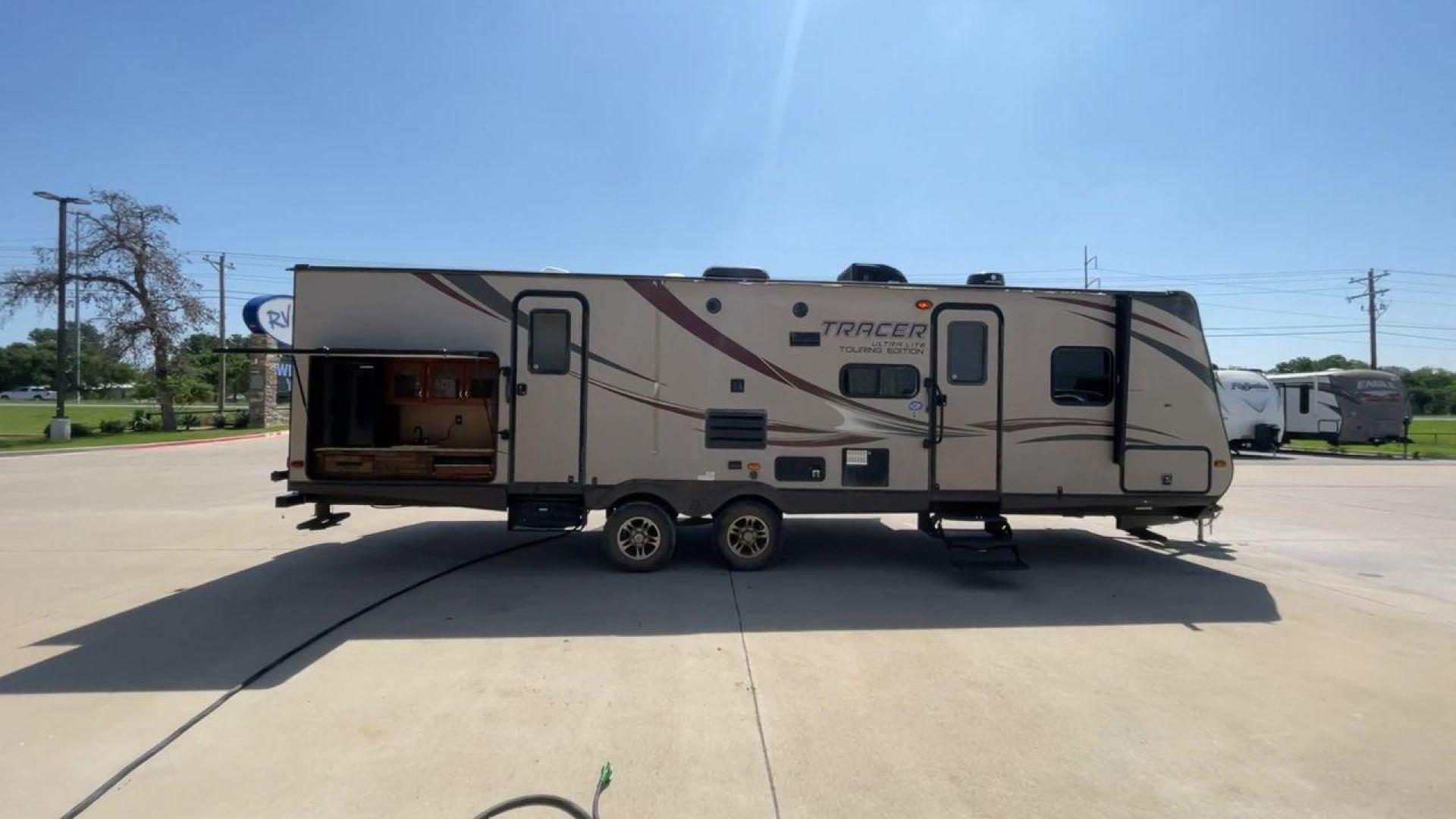 2015 WHITE FOREST RIVER TRACER 3150BHD (5ZT2TRXB5FB) , Length: 34 ft. | Dry Weight: 6,955 lbs. | Slides: 2 transmission, located at 4319 N Main St, Cleburne, TX, 76033, (817) 678-5133, 32.385960, -97.391212 - In this 2015 Forest River Tracer 3150BHD, you are guaranteed more campers, more features, and more fun! This travel trailer measures exactly 34 ft. in length with a dry weight of 6,955 lbs. and a payload capacity of 2,755 lbs. It includes two doors, two slides, and one awning. This model featu - Photo#2