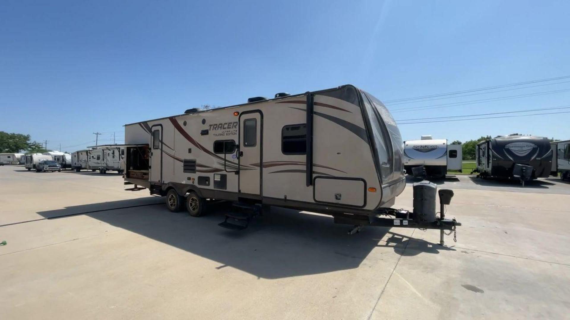 2015 WHITE FOREST RIVER TRACER 3150BHD (5ZT2TRXB5FB) , Length: 34 ft. | Dry Weight: 6,955 lbs. | Slides: 2 transmission, located at 4319 N Main St, Cleburne, TX, 76033, (817) 678-5133, 32.385960, -97.391212 - In this 2015 Forest River Tracer 3150BHD, you are guaranteed more campers, more features, and more fun! This travel trailer measures exactly 34 ft. in length with a dry weight of 6,955 lbs. and a payload capacity of 2,755 lbs. It includes two doors, two slides, and one awning. This model featu - Photo#3